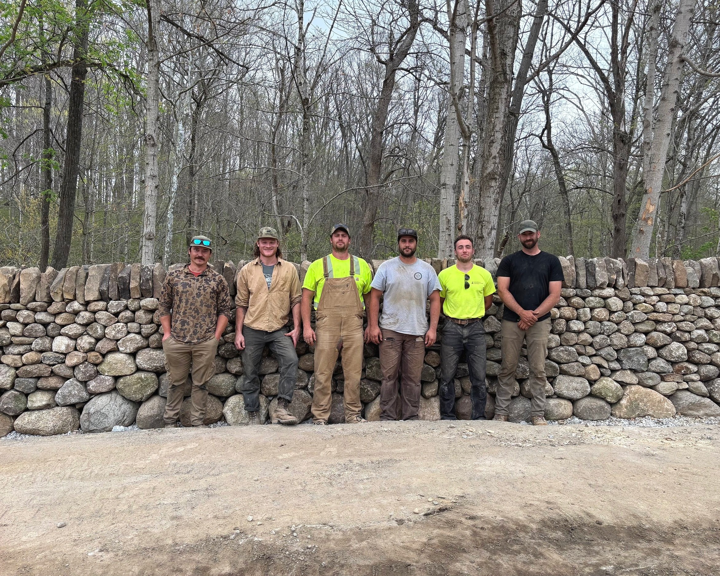 Dry fieldstone entrance walls with Stone Bear Masonry. Huntington, IN. Left to right: James Cleary, Jackson Conn, Bryce Hollingsworth, Stew Devaney, Ursa, Mathew Nunn