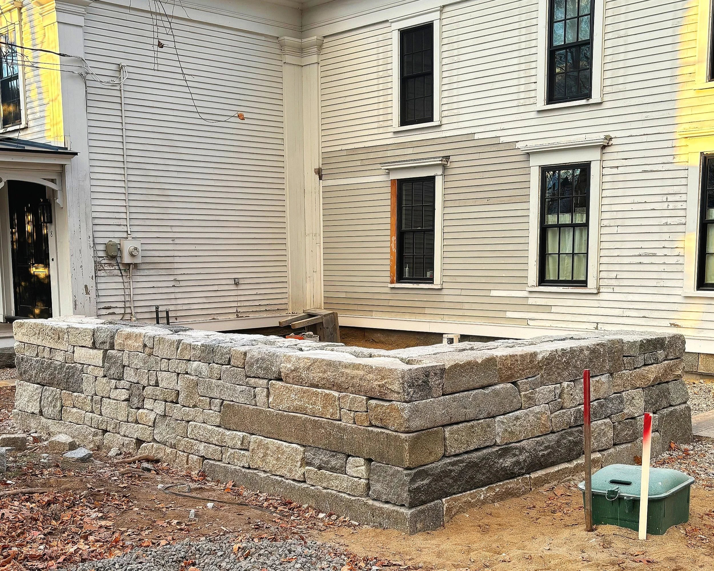 Reclaimed granite entrance walls with Terrapin Landscapes. Bethal, ME
