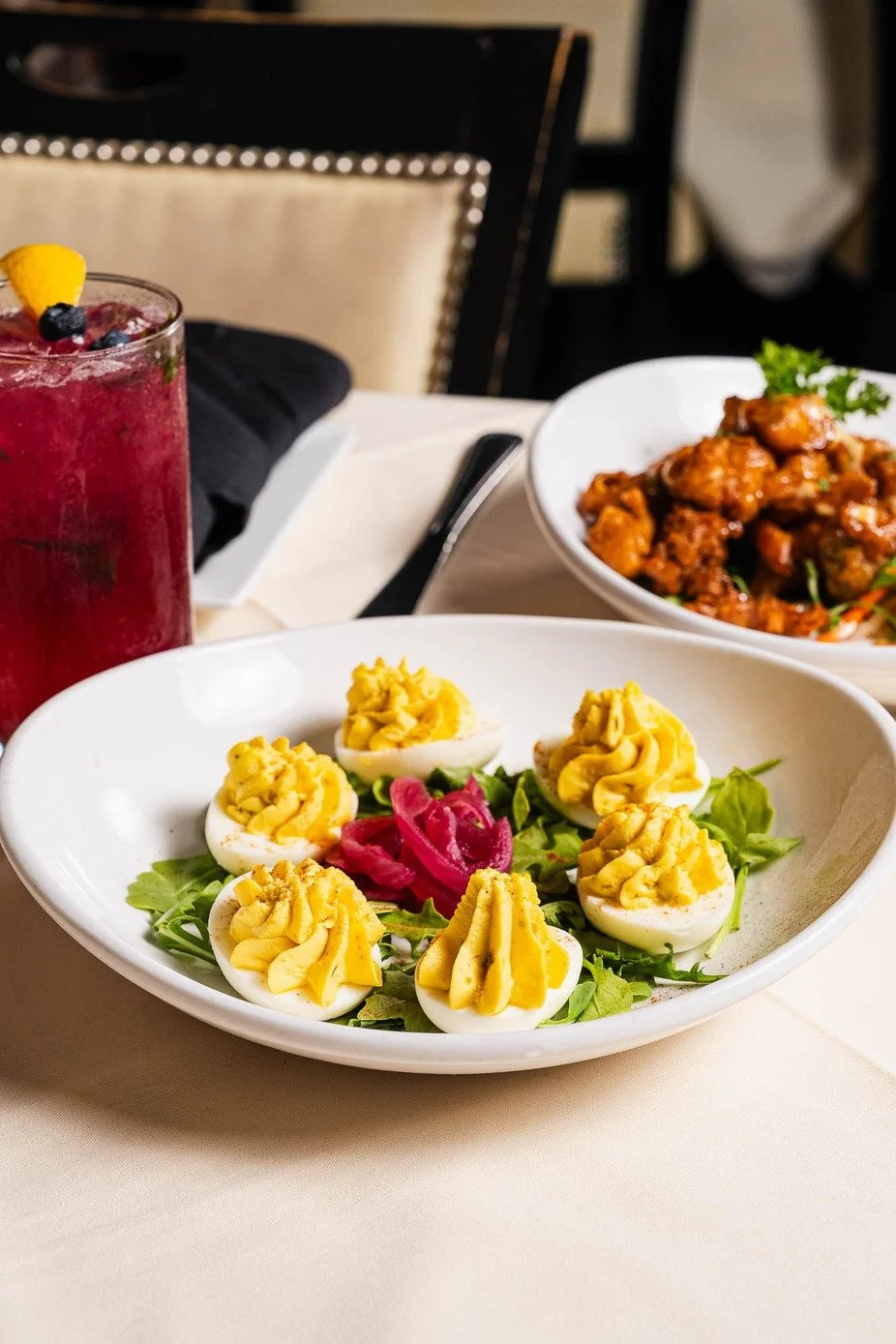 Would you like to start with a classic appetizer everyone loves? Southern Deviled Eggs are made with farm fresh eggs, sweet pickle relish, and a hint of paprika. Which drink would you pair with these? 🍸🥚

#Table13 #Classic #RestaurantBar #GlutenFre
