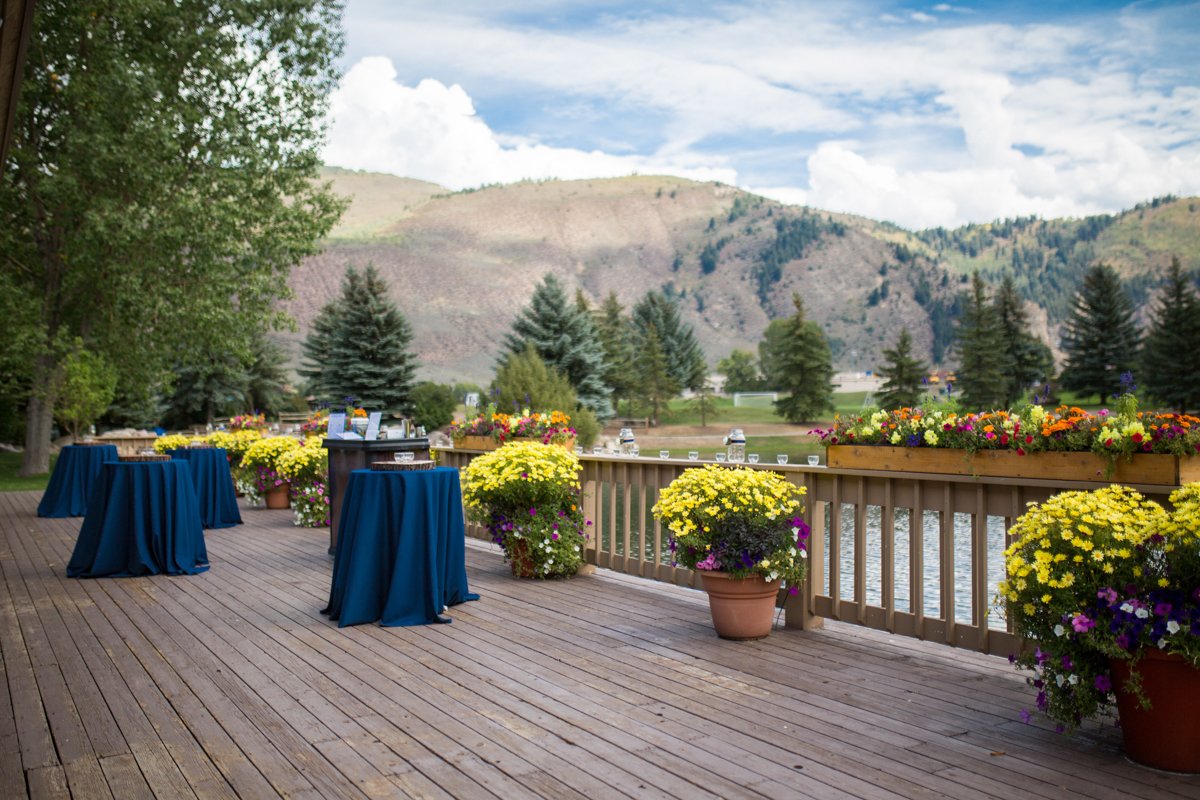 Scene setter shot of a reception area on a deck in the mountains of Vail.