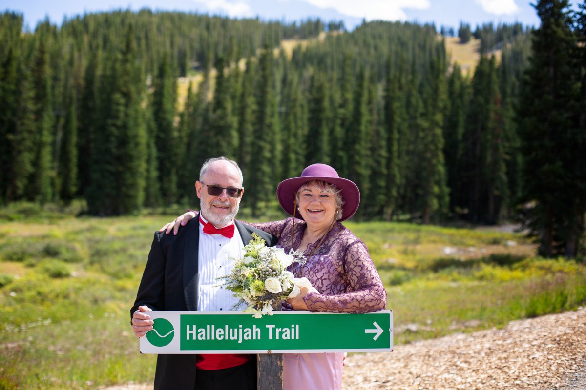 Couple celebrating getting married at their favorite trail on the mountain.