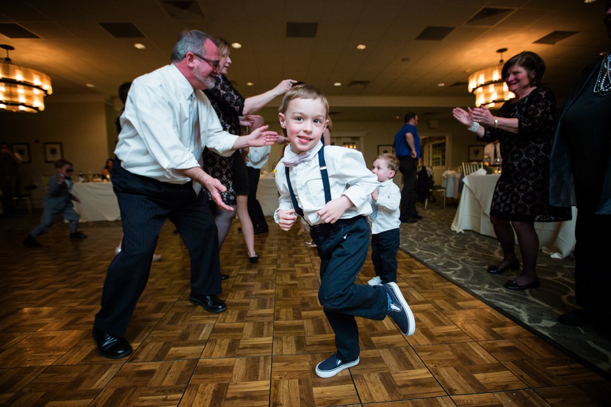 small child being goofy on the dance floor