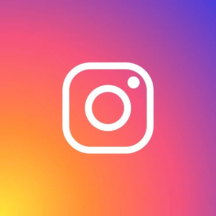 Instagram logo centered on a colorful gradient background.