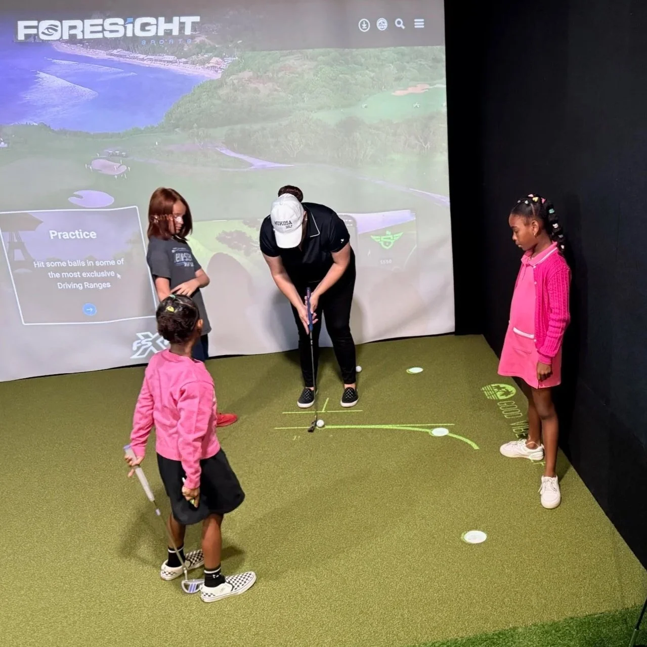 Kids putting using Putt View at Good Vibes Golf