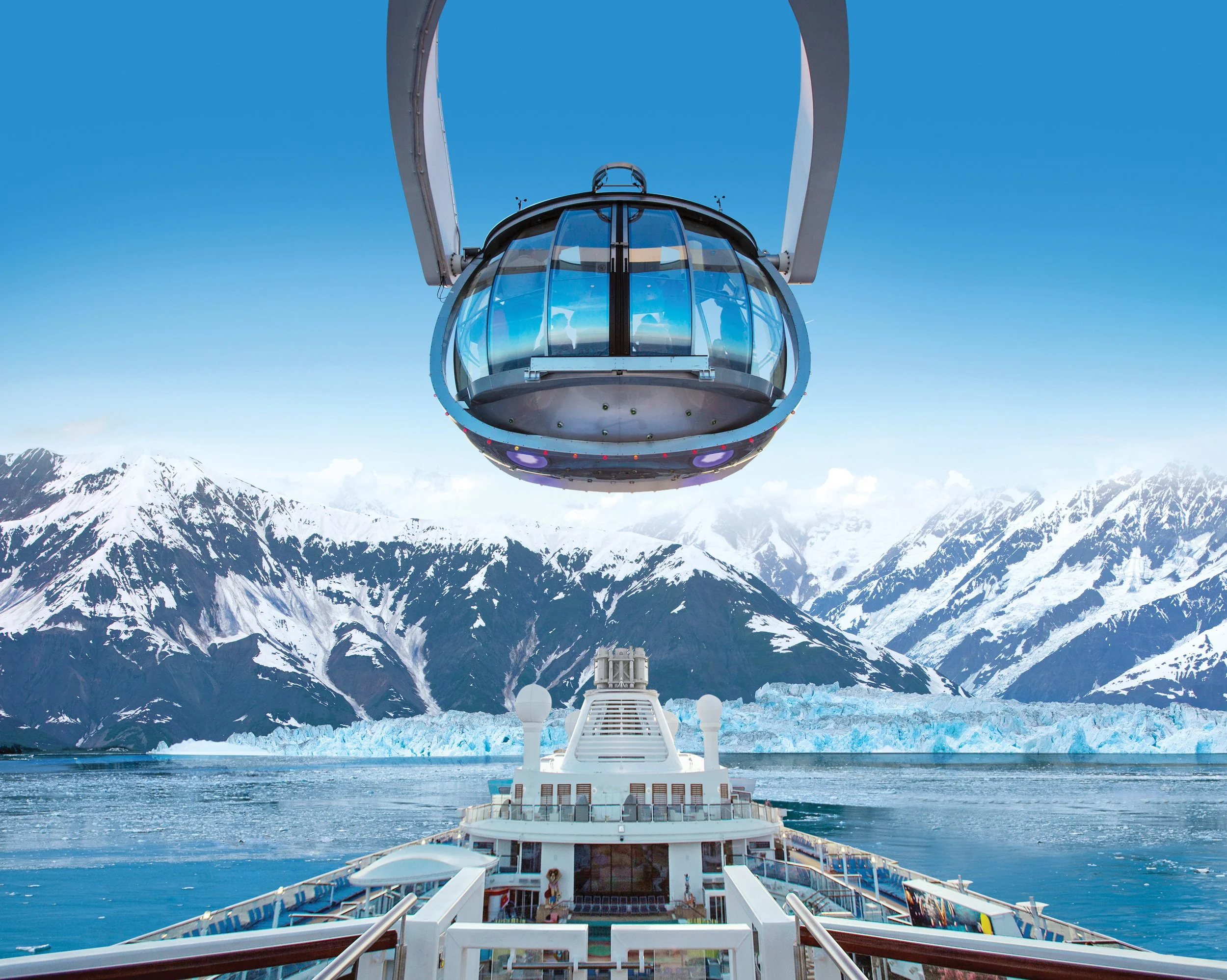 View from a cruise ship looking at mountainous icy landscape with a glacier, snow-covered mountains, and a helicopter above the ship.