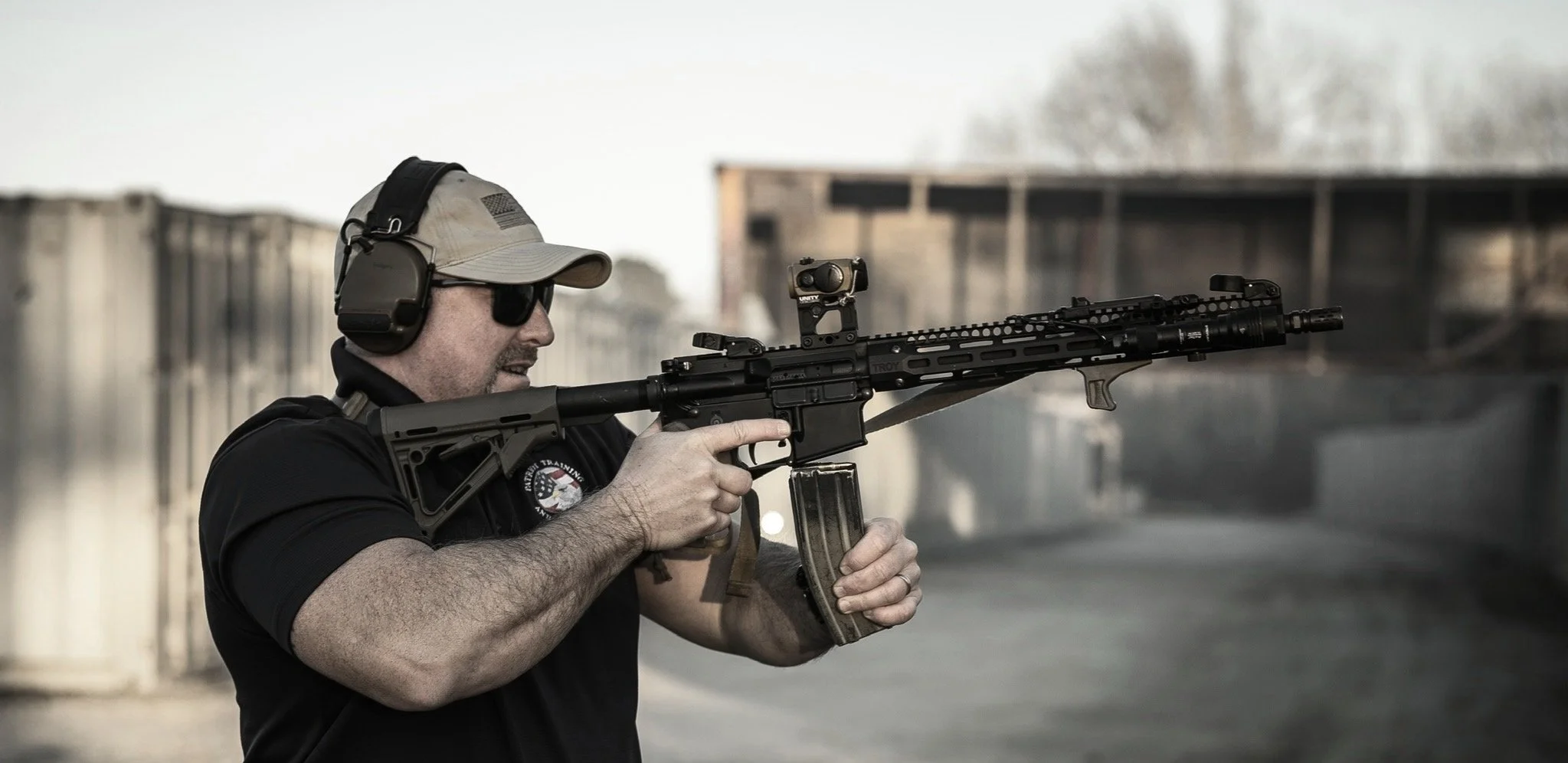 A man inserting a magazine into an AR15.
