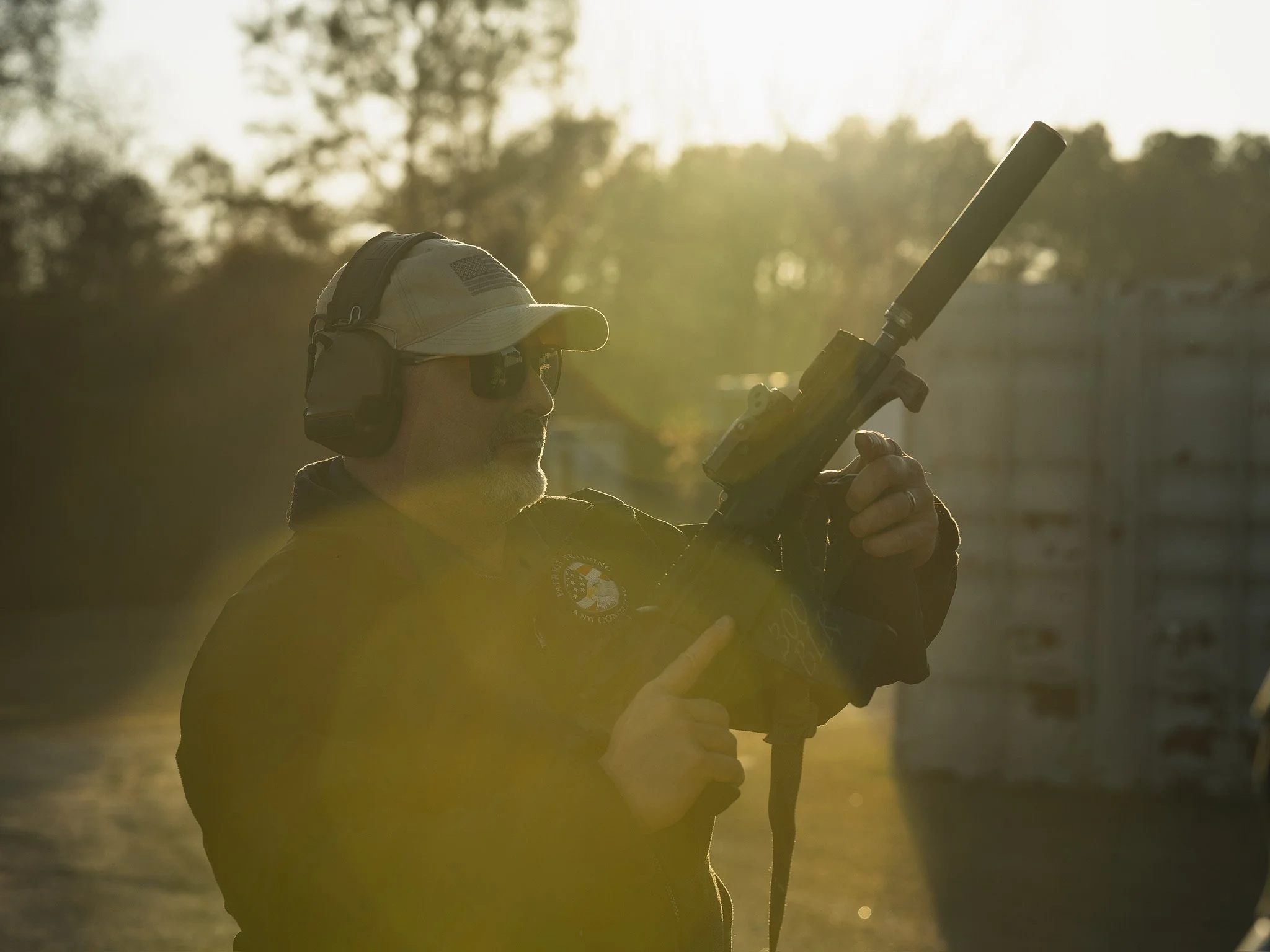 A man with a suppressed 300 blackout AR pistol.