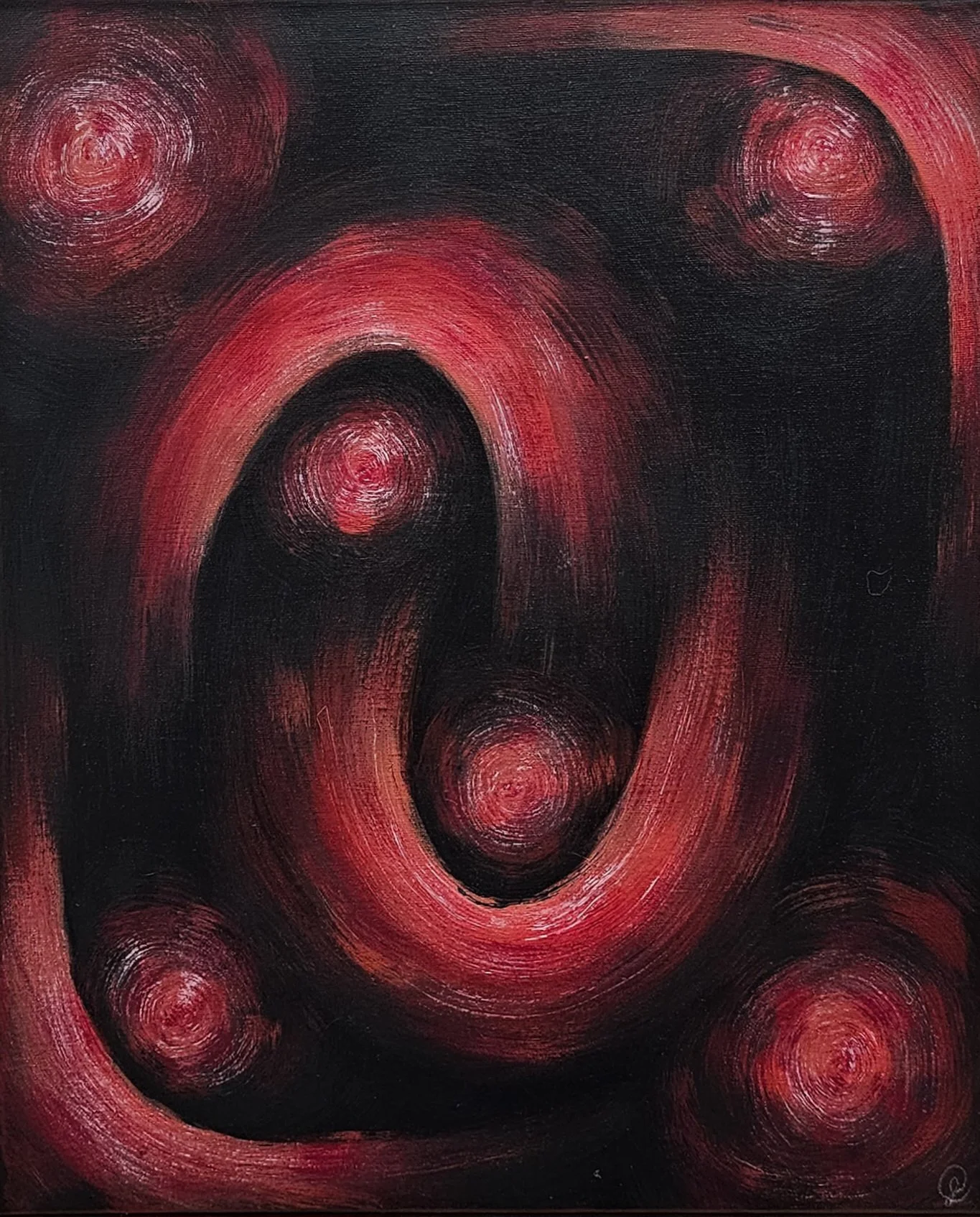 An abstract painting with black and red circular and spiral patterns that have a swirling effect.