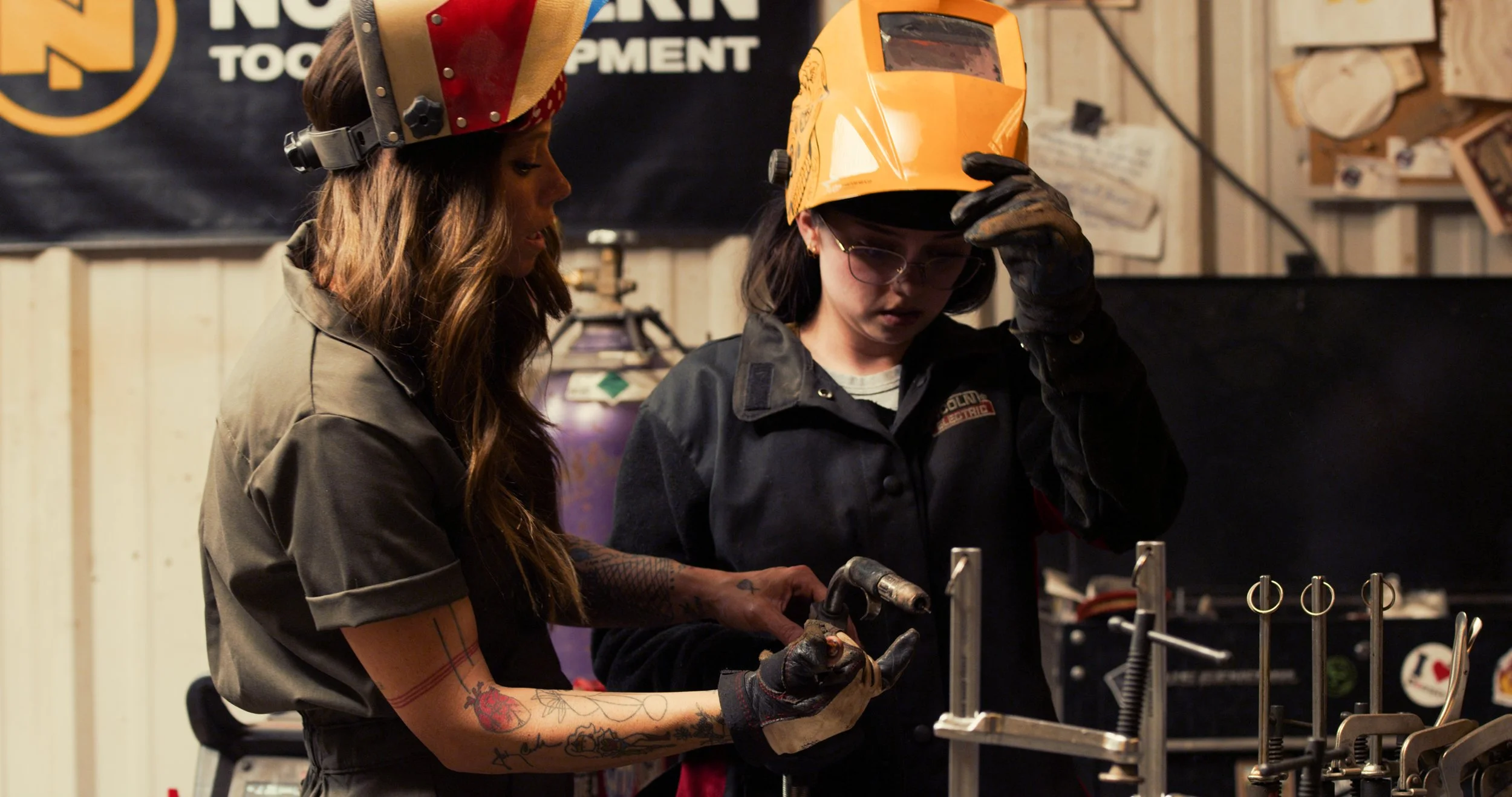 Rae Ripple teaching hands on welding skills
