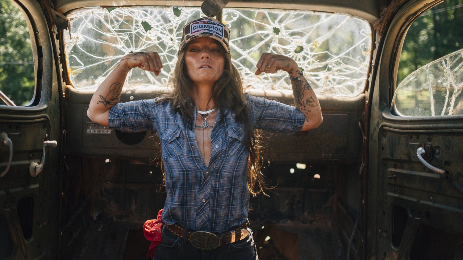 Rae Ripple flexing inside an old vehicle