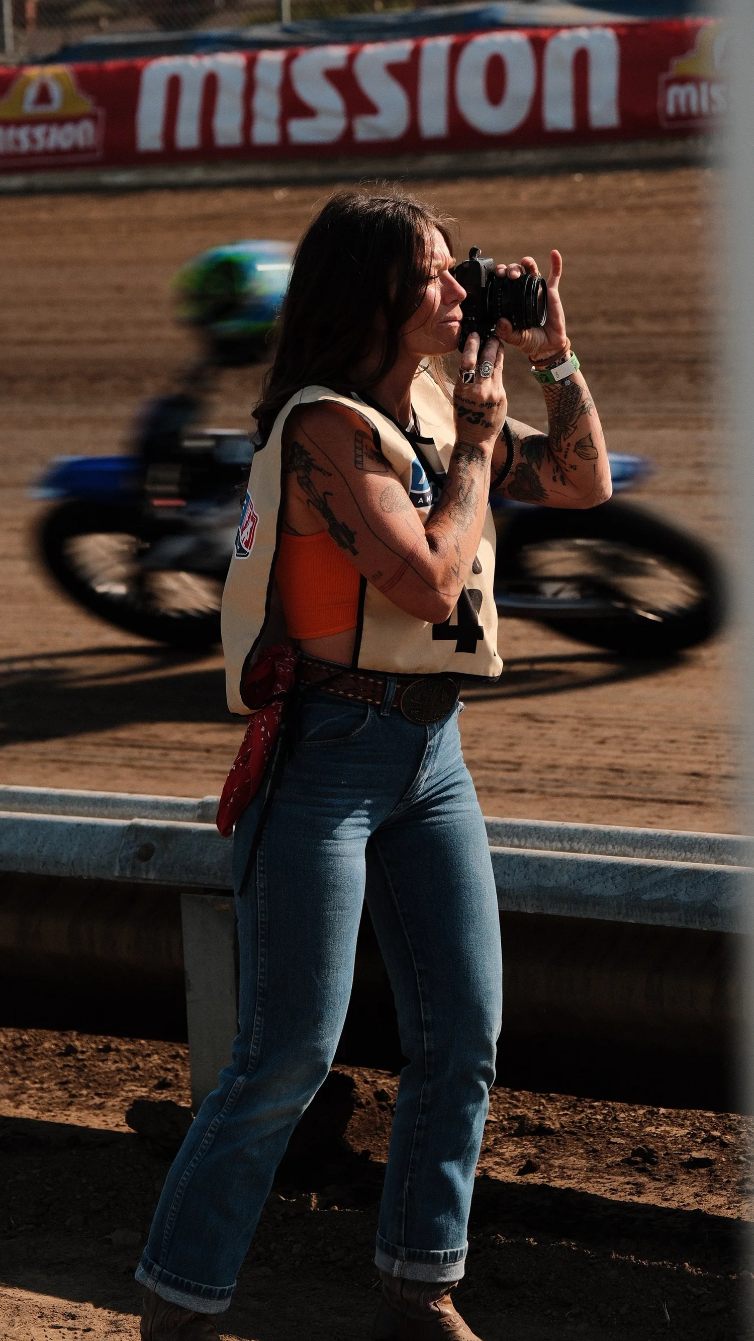 Rae Ripple photographing a motorcycle race