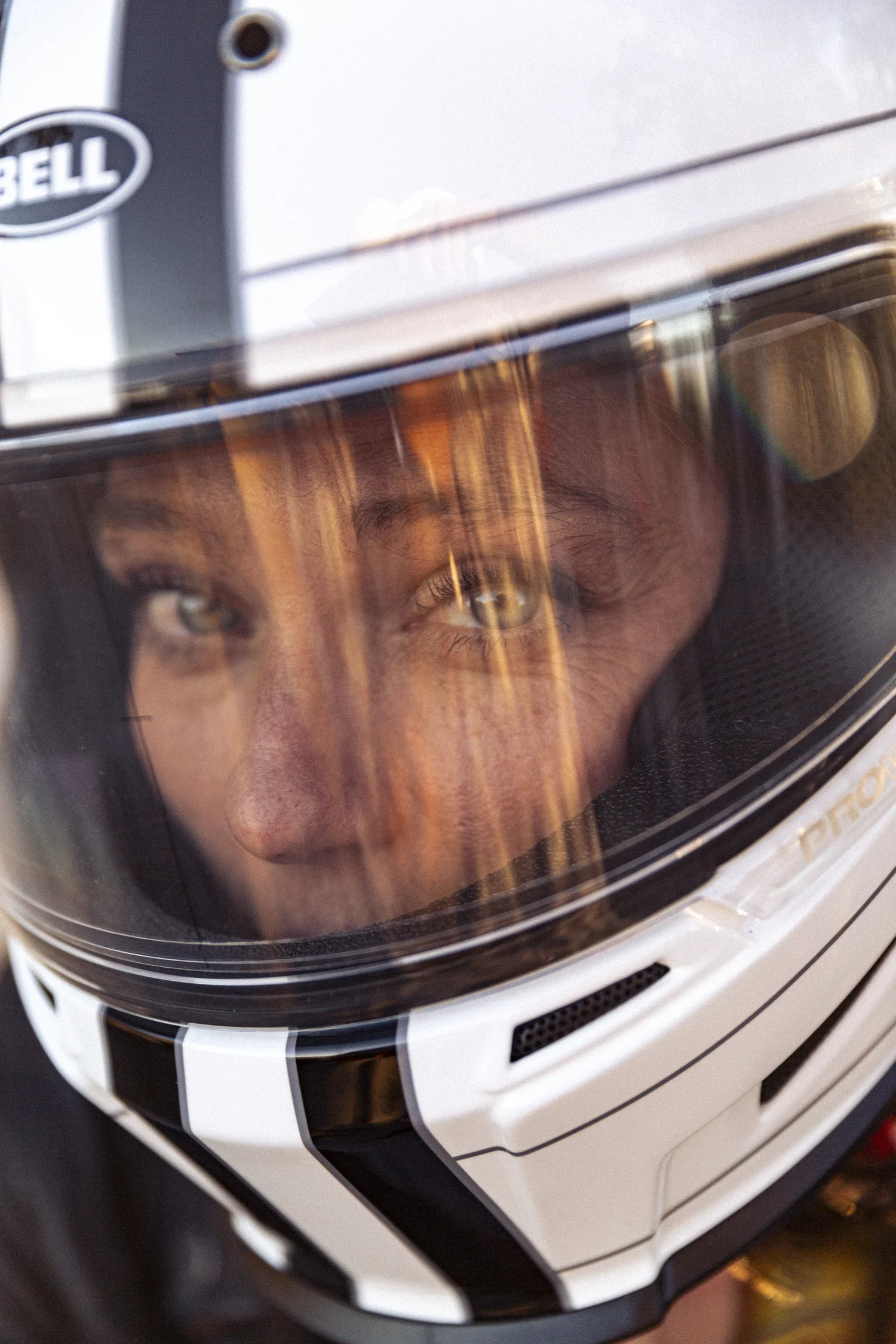 Rae Ripple looking through a racing helmet