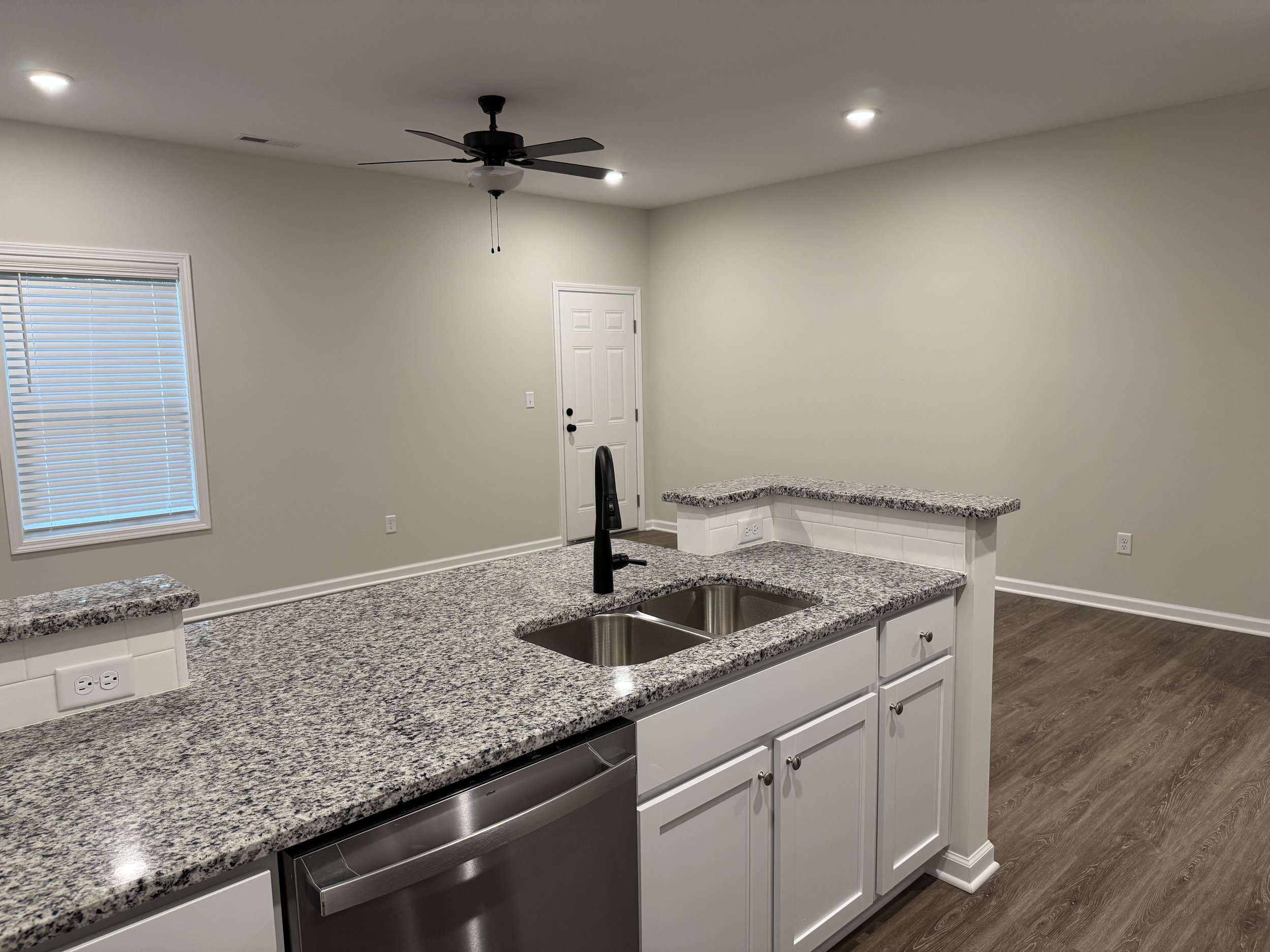 Open view above sink with breakfast bar.