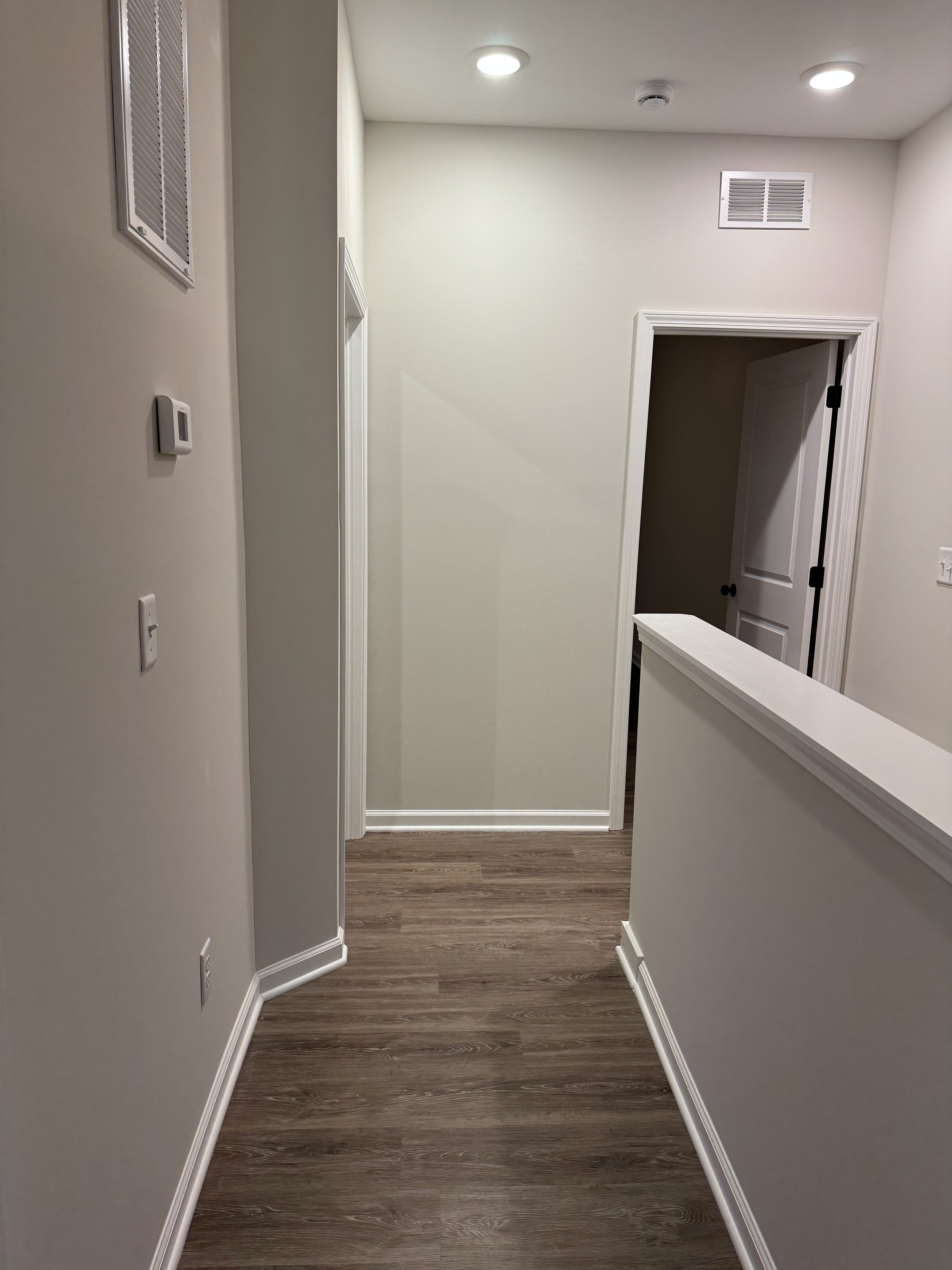Fresh, functional upper-level hallway.