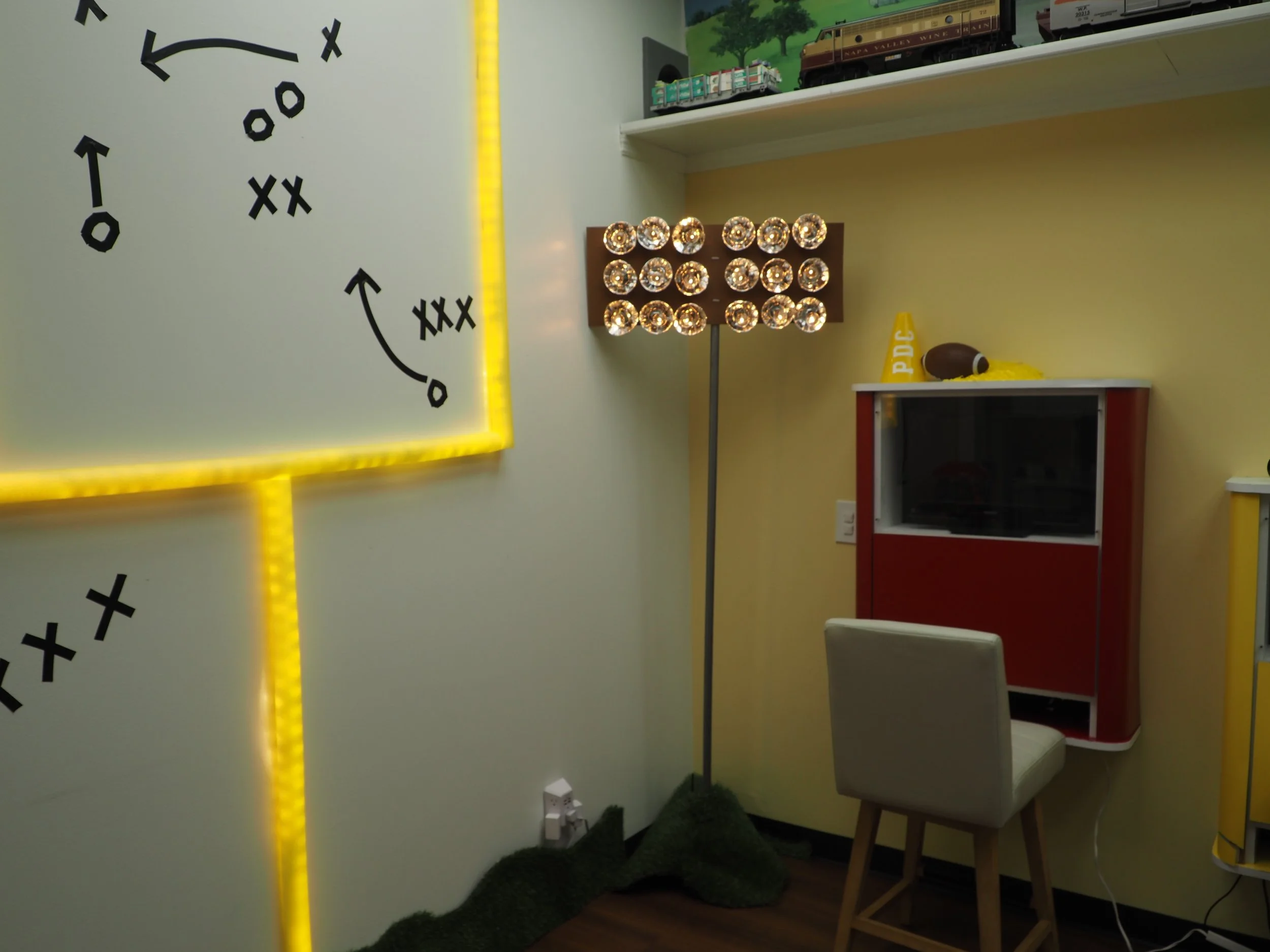 Electrical tape X’s and O’s on wall for football play design
