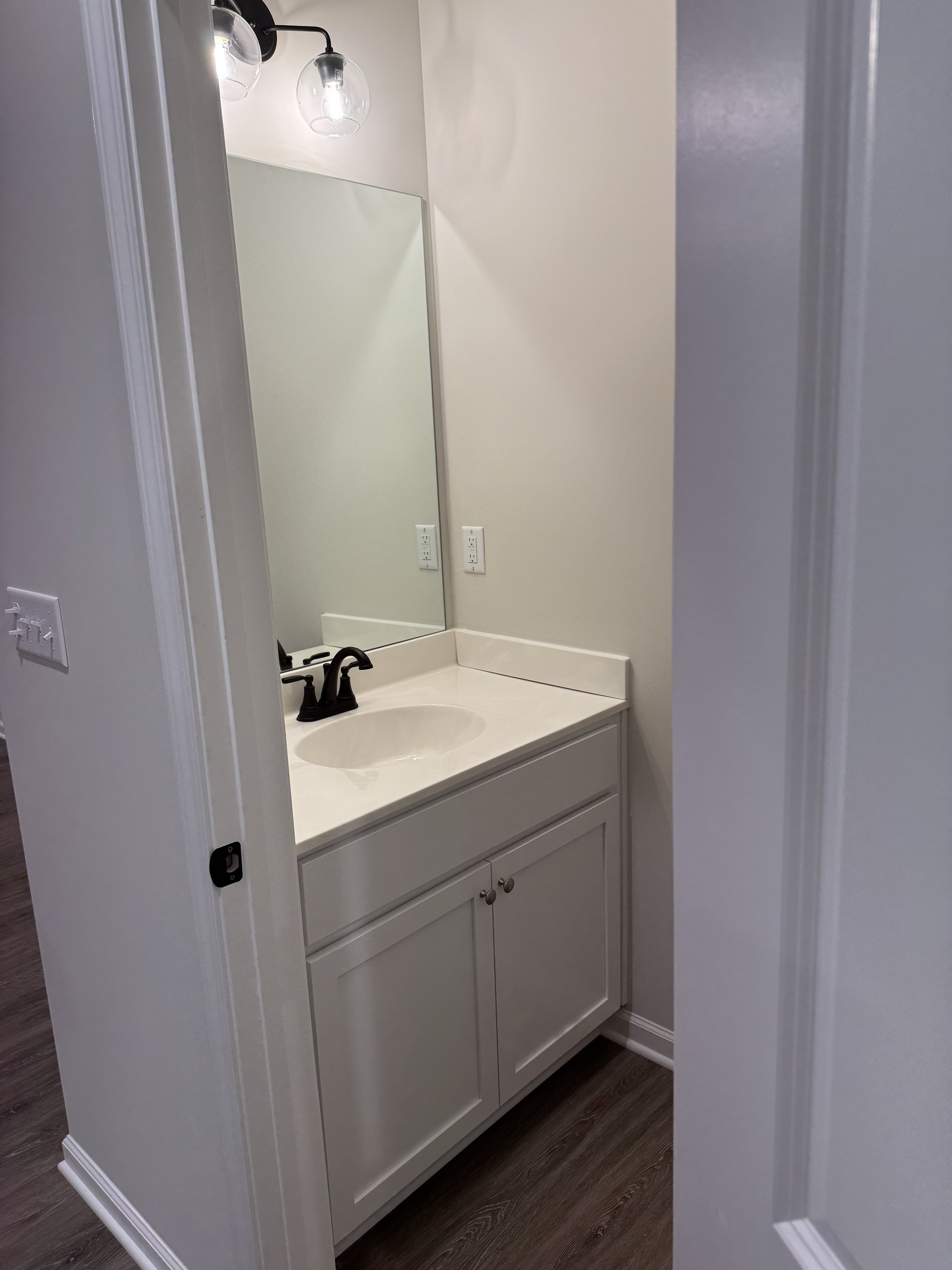 Crisp downstairs powder room.