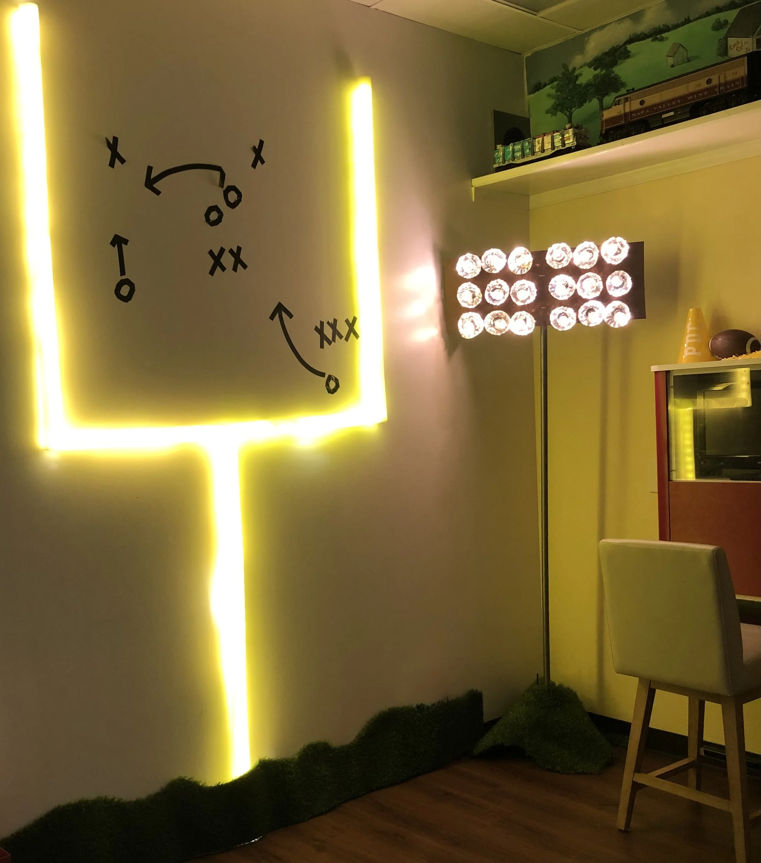 DIY glowing football goal post made with pool noodles and LED lights