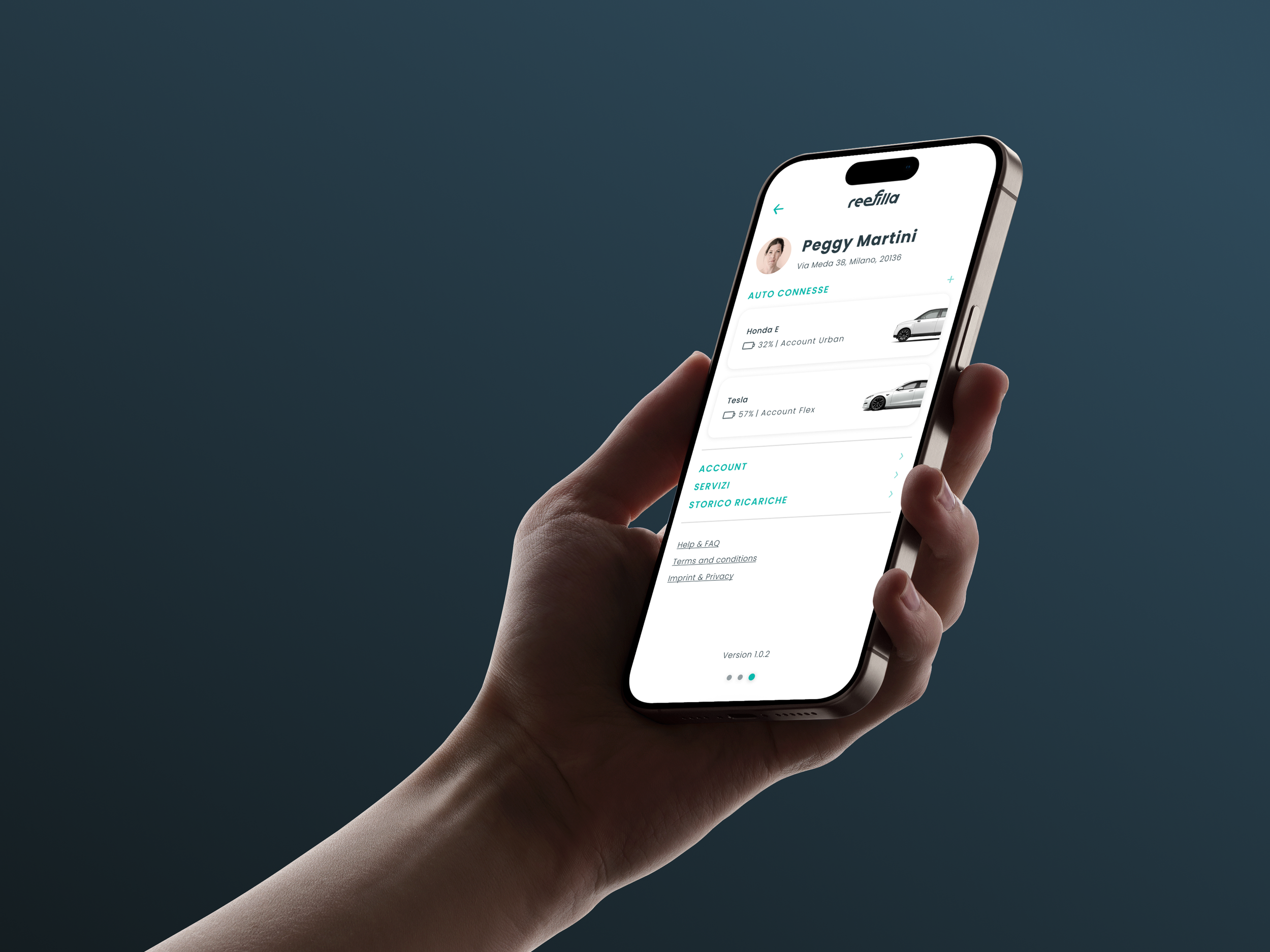 Hand holding a smartphone displaying a car management app interface, listing connected vehicles with details like charge percentage and type, set against a gradient blue background.
