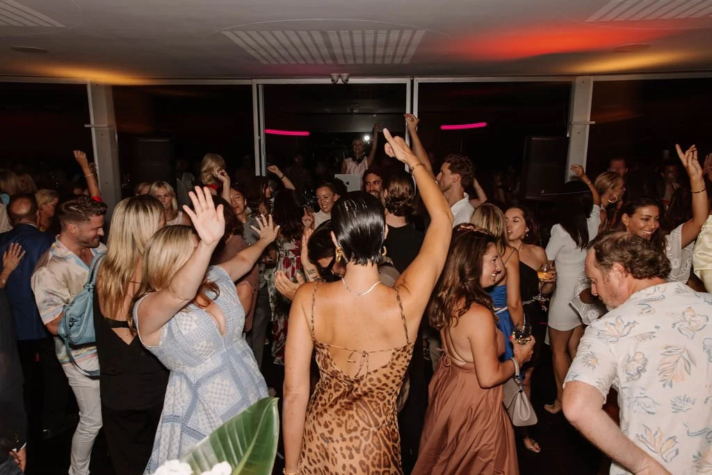 People dancing on the dancefloor with a DJ at CATALINA Rose Bay Birthday Party