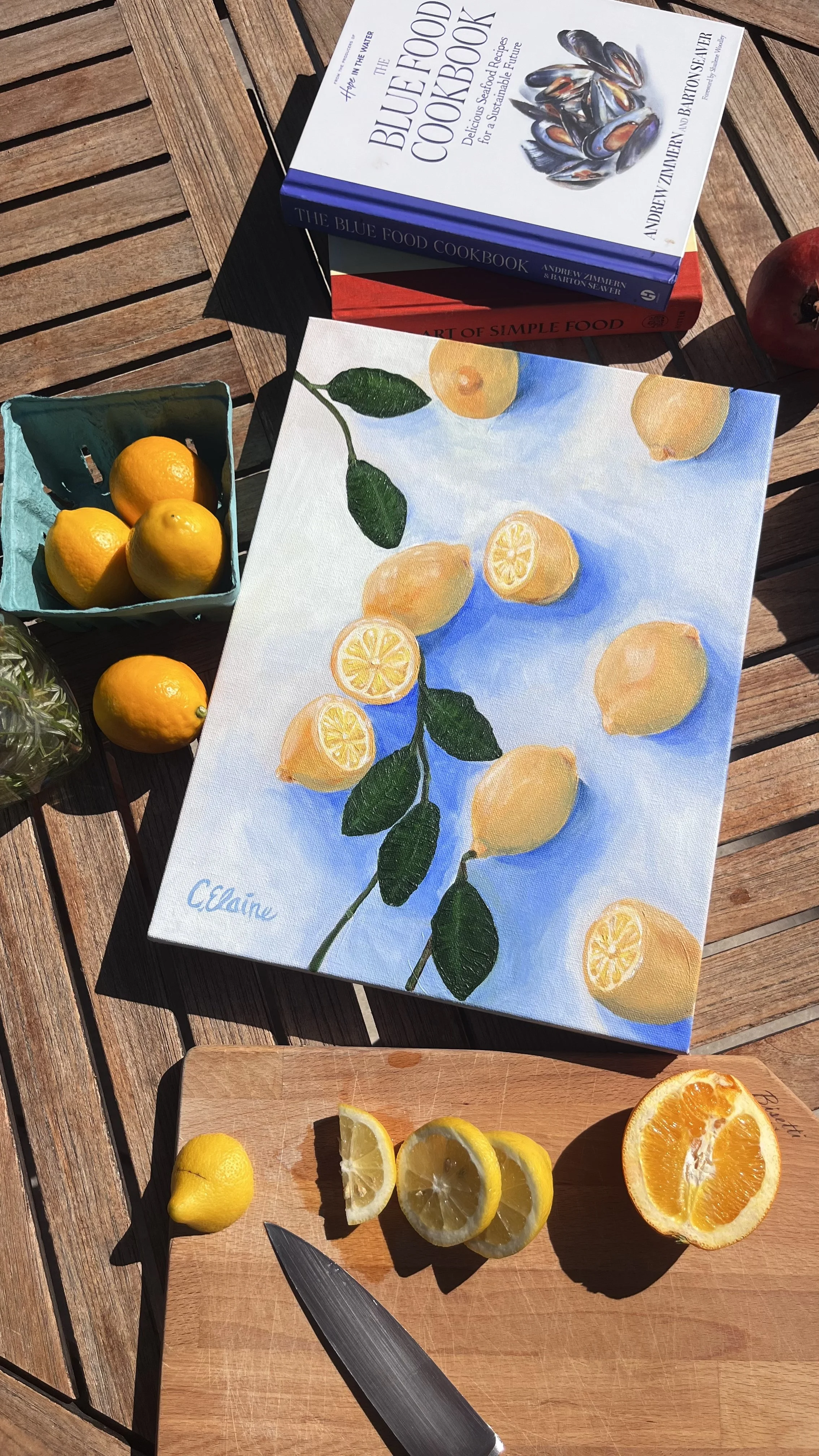 mediterrean style lemon painting on rustic wood table for coastal chic home design