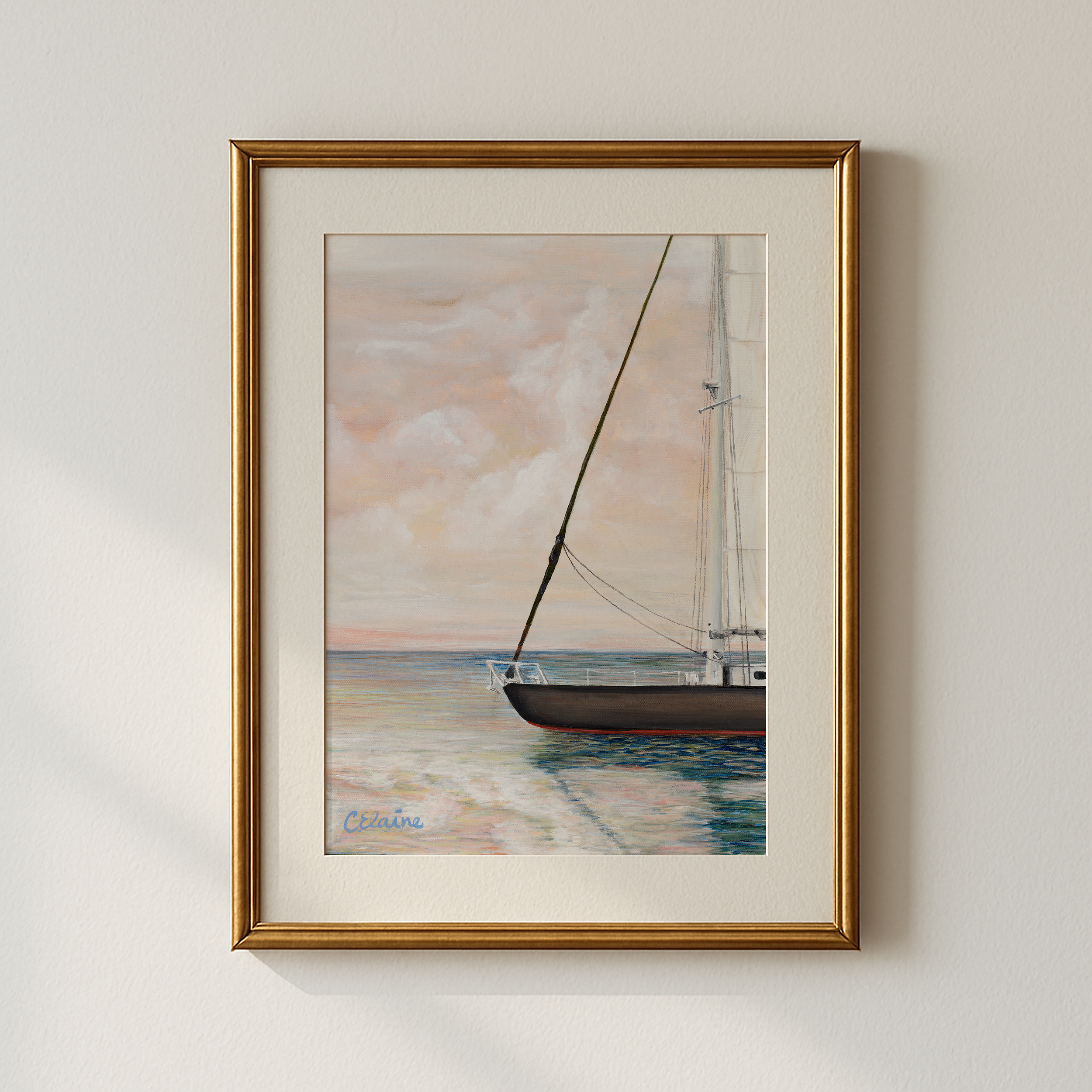 Framed mediterranean sailboat on the water painting with a serene background of glowing sunset and clouds