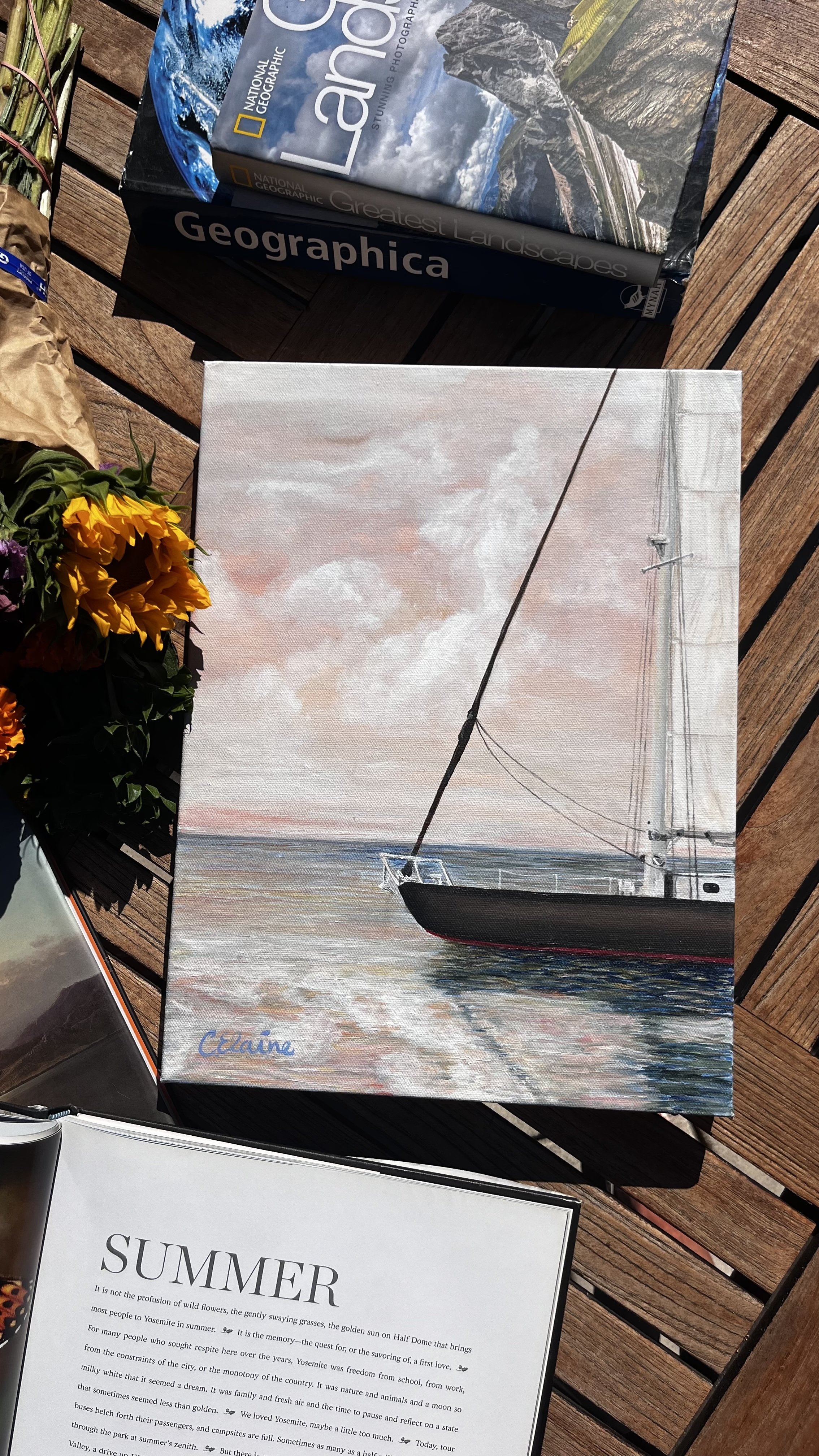 mediterranean sailboat on the water painting with a serene background of glowing sunset and clouds