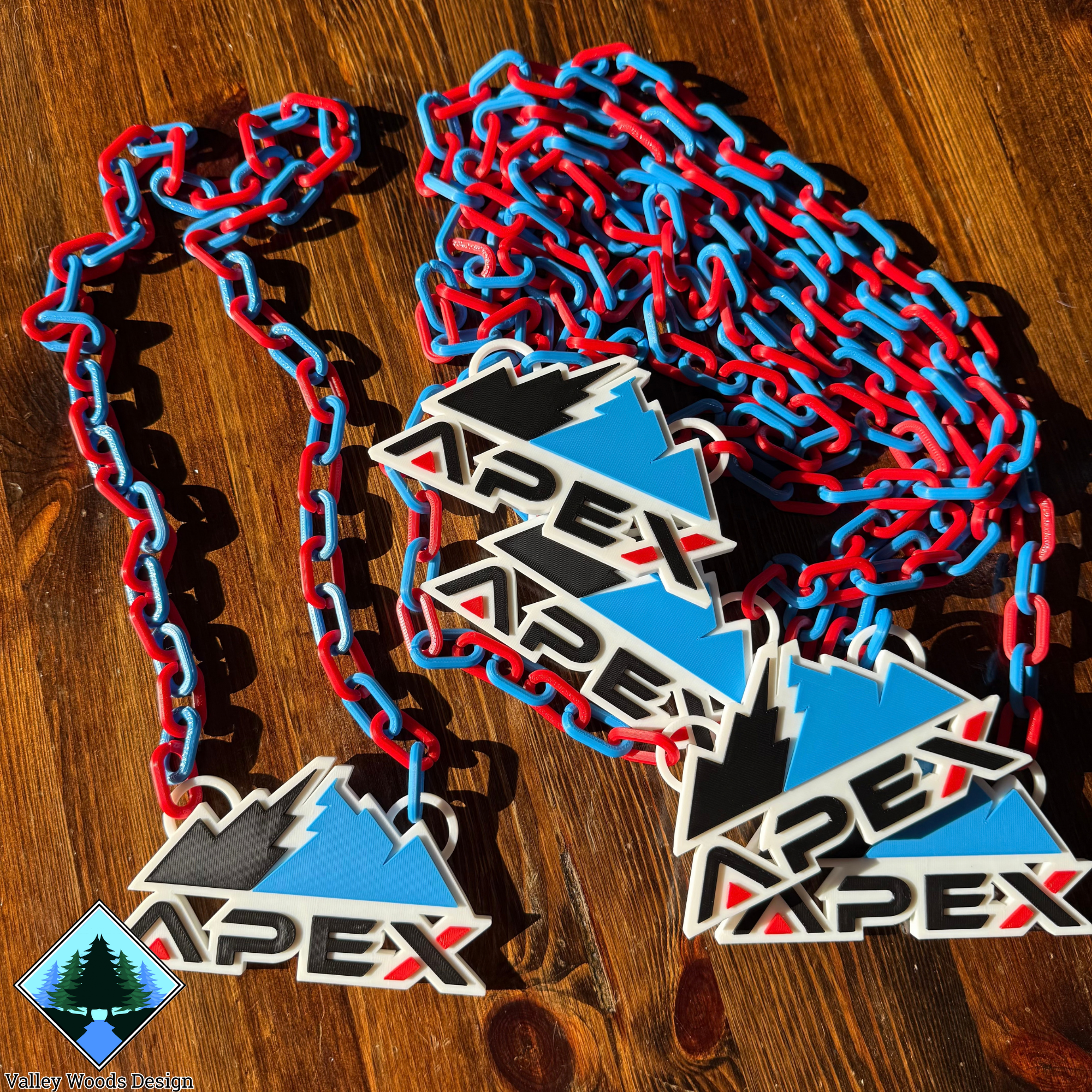 Six custom APEX Athletics baseball chains with red and blue links displayed together
