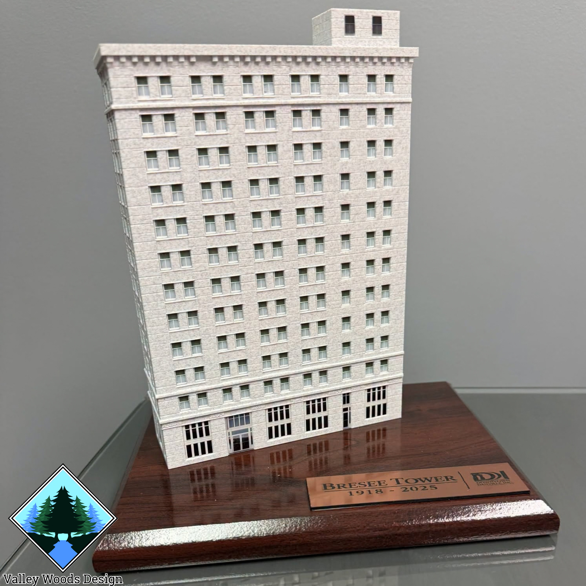 Finished Breese Tower replica on wooden display base with commemorative plaque