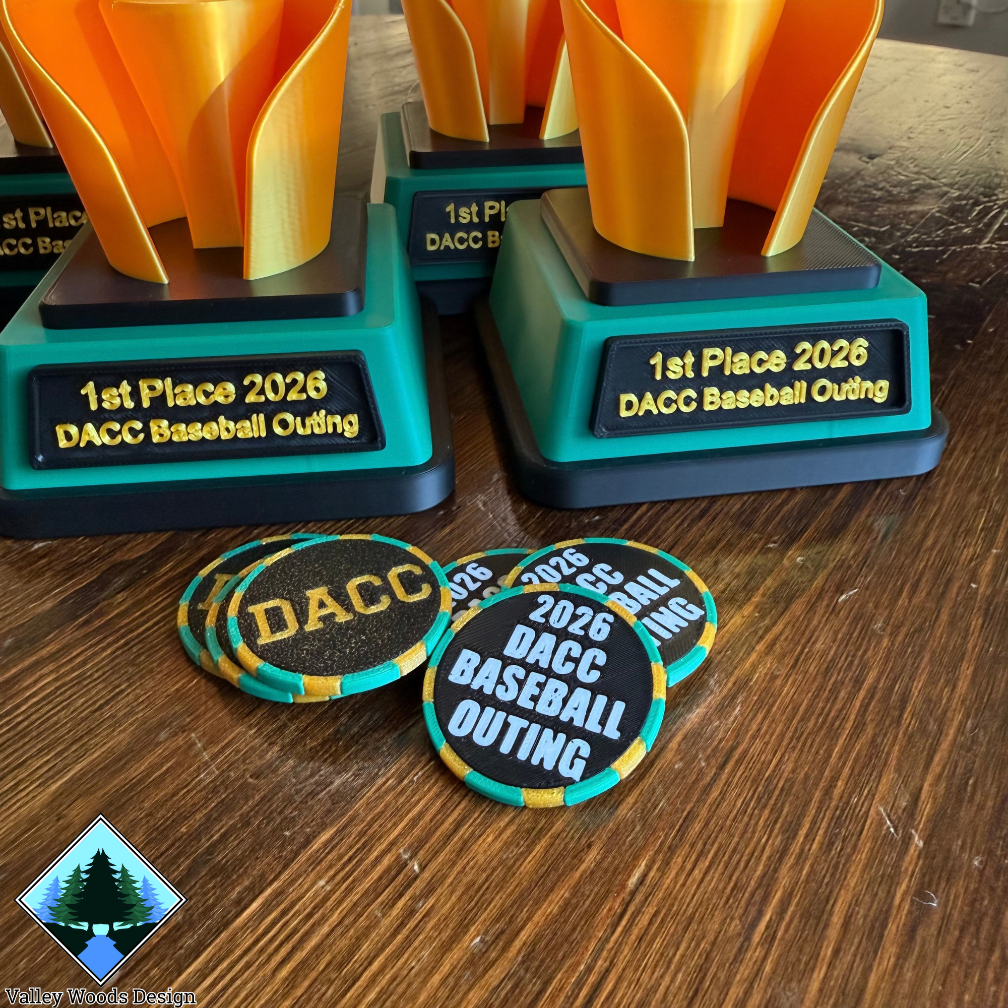 Closeup of custom DACC Baseball Golf Outing trophies and participant ball markers