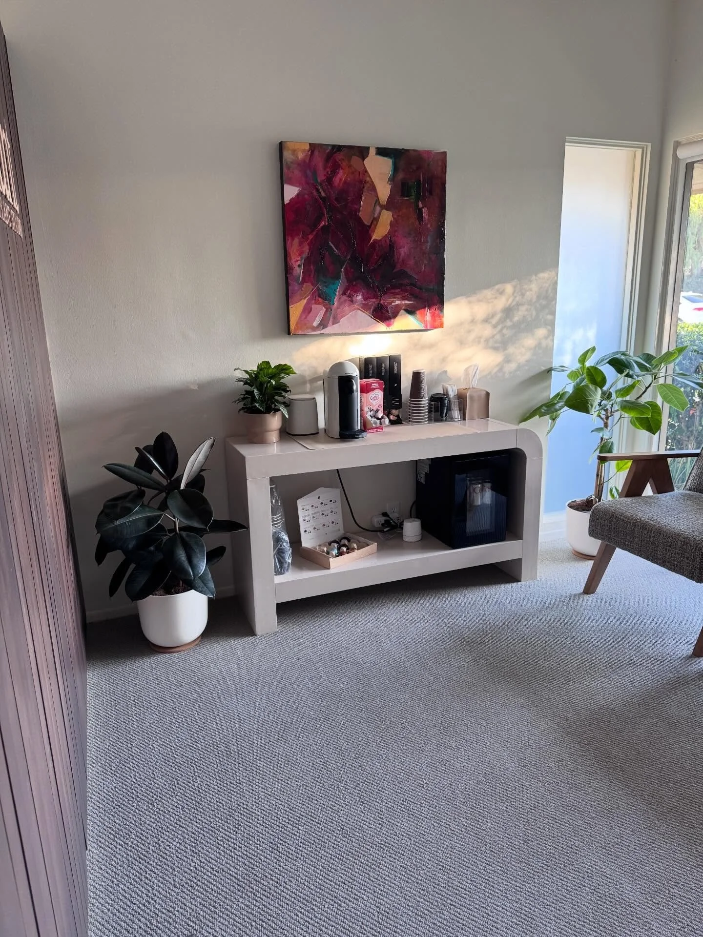 waiting room essentials =
1. Nespresso is a must 
2. Diet Coke obviously 
3. Water classic 
4. Golden hour glow 
5. new art by @sean.barrett.artist