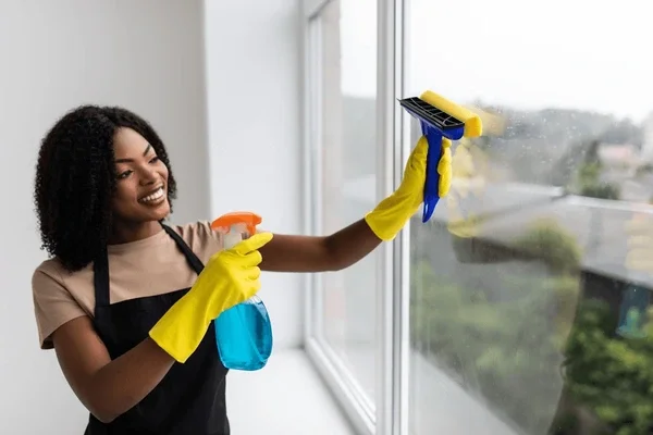 beautiful-african-woman-using-duster-600nw-2055811637.webp