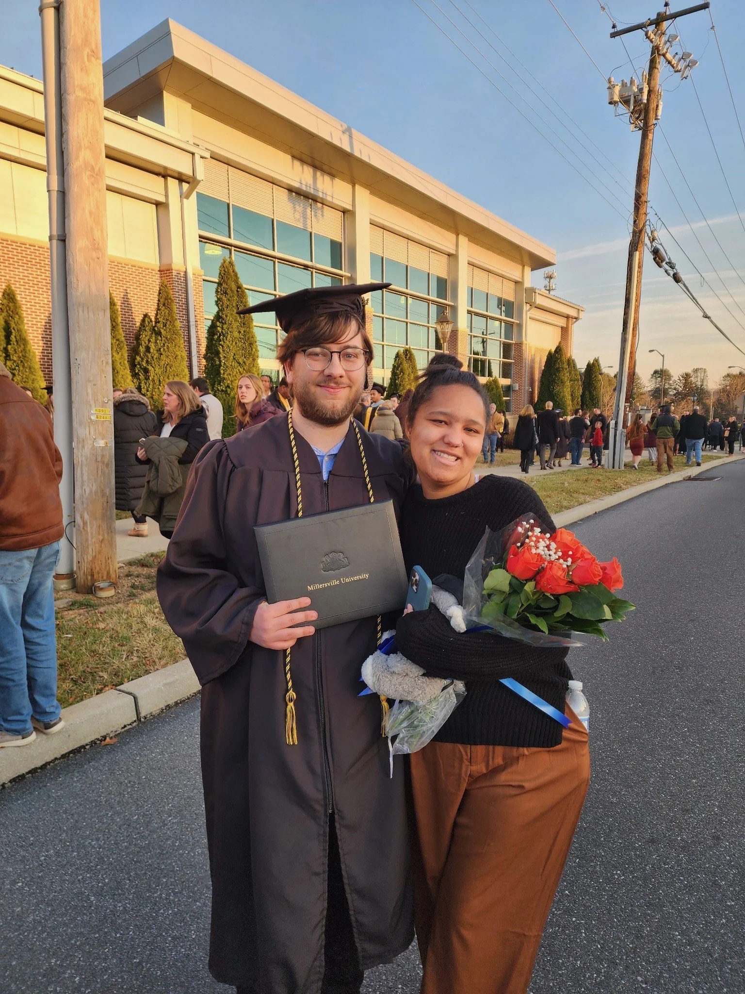 A picture of Hunter Bair and his partner at his graduation from Millersville University