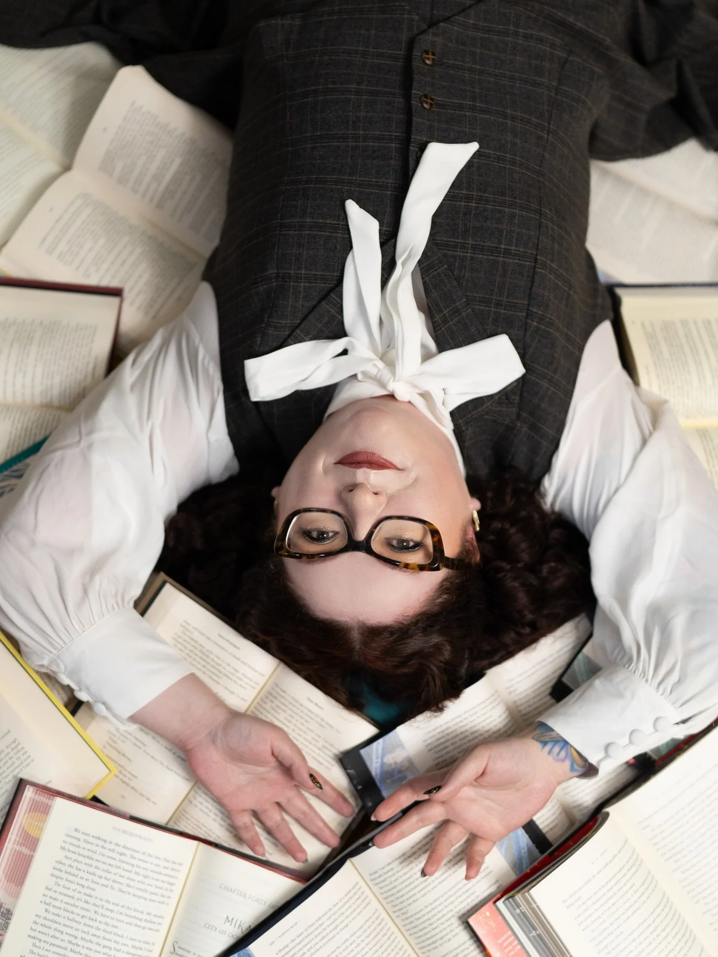A few favorites from @alexandrafoleywrites branding session in her home library 📚 This was one of two looks, and it&rsquo;s giving ✨irrevocably influenced by The Mummy ✨ Who else wants to lay in a pile of books? 😍