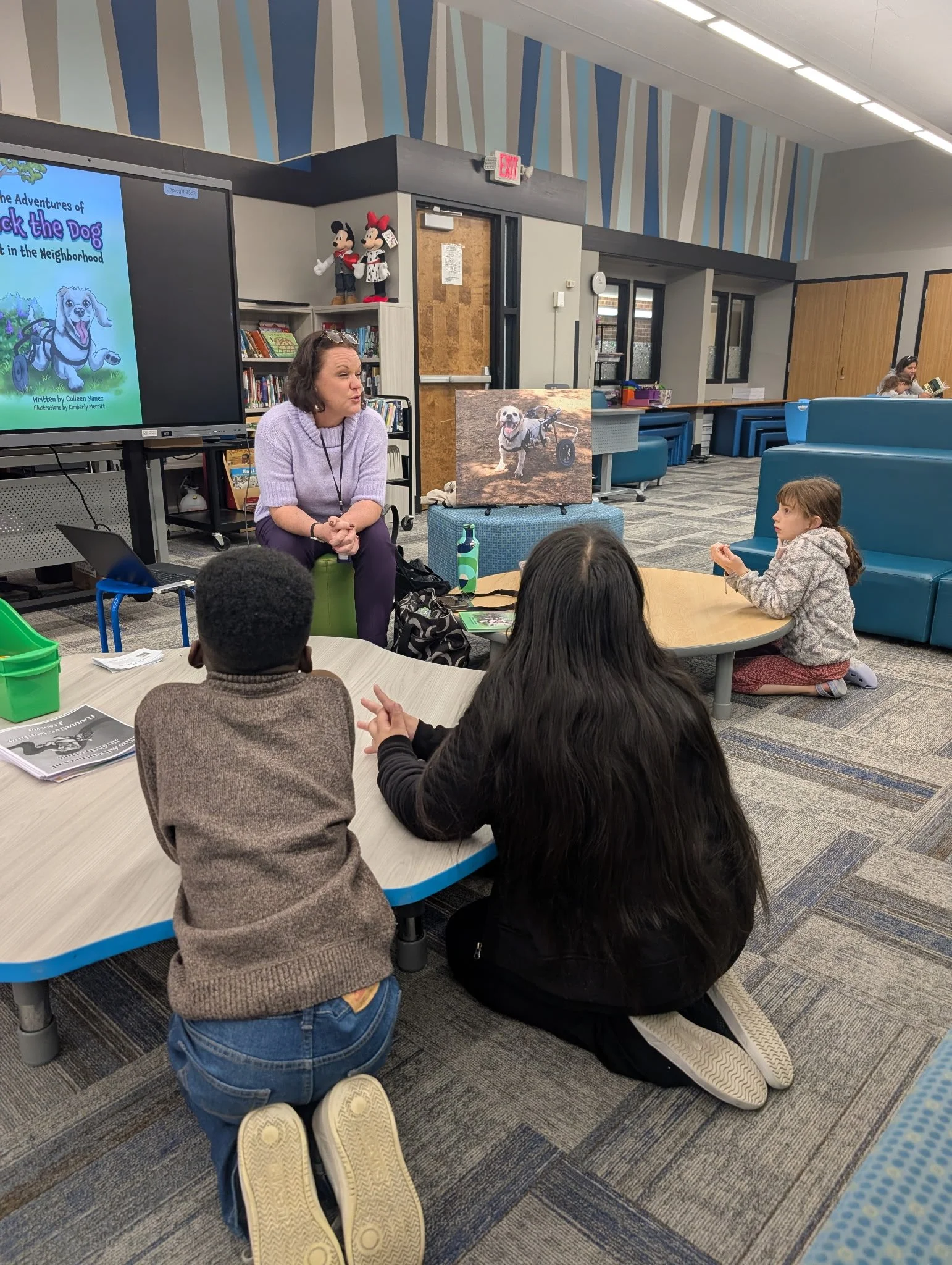 Colleen Yanez, children's book author, reading The Adventures of Jack the Dog in an elementary school.