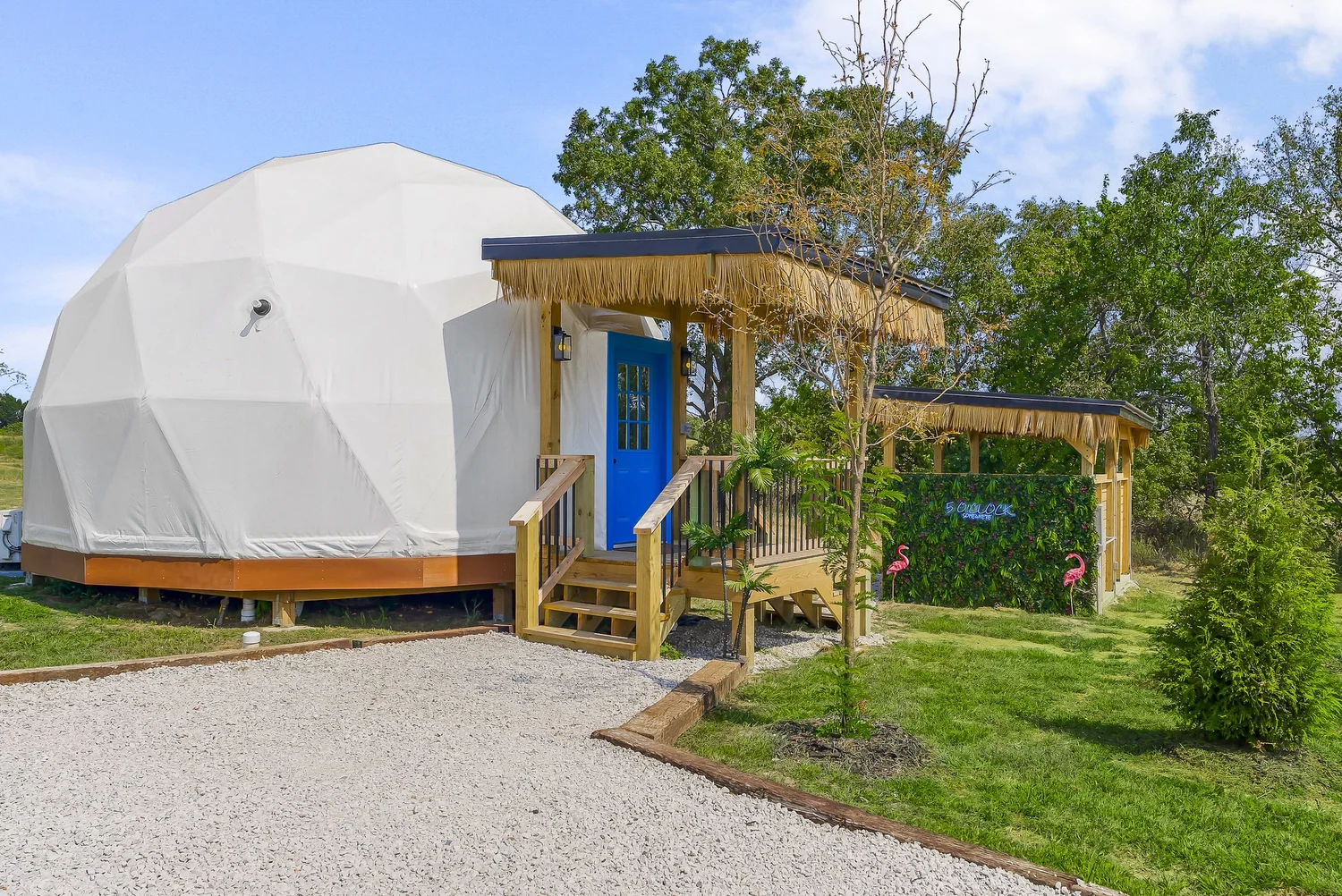 5 O'Clock Somewhere tiki-themed geodesic glamping dome with thatched hut