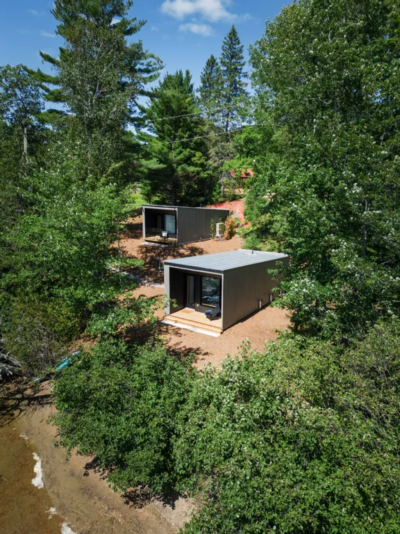 Tranquil lakeside cabins tucked among the trees, just steps from the shoreline.