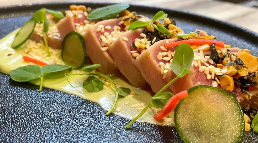 Seared tuna with cucumber, sesame, and avocado—artful and nourishing.