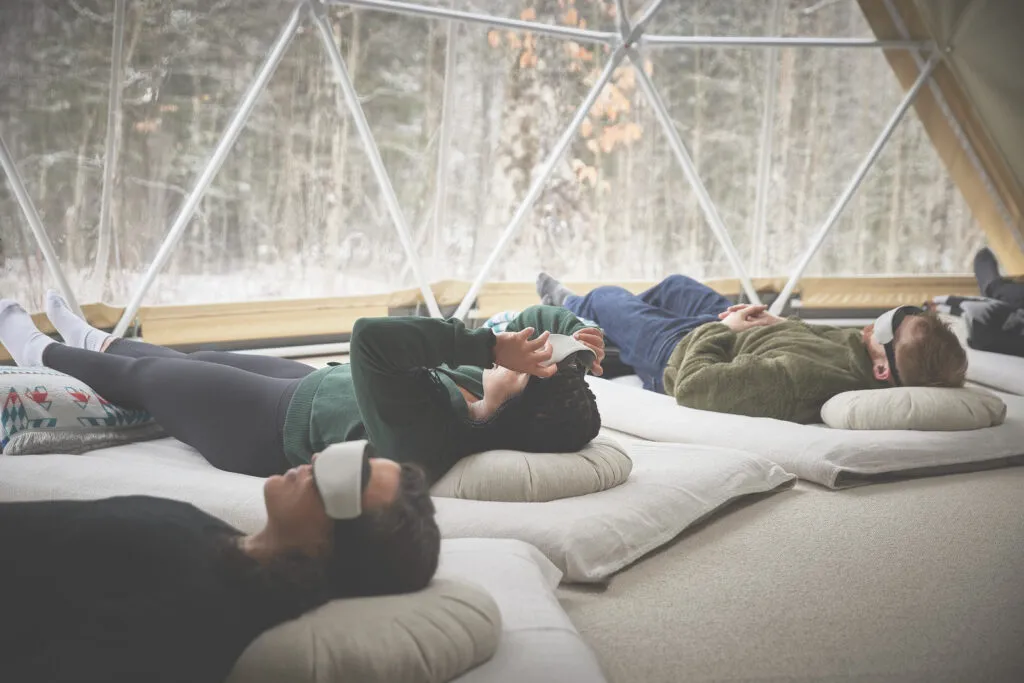Guided somatic rest inside the geodome—soft mats, eye pillows, and deep inner quiet.