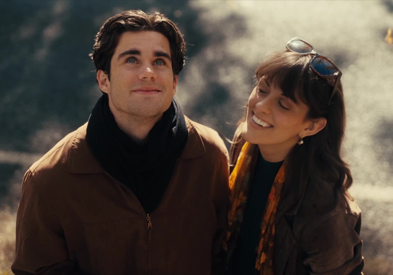 A still from a commercial tourism brand video in the Marysville area of Victoria. It features a young couple staring into the sky.