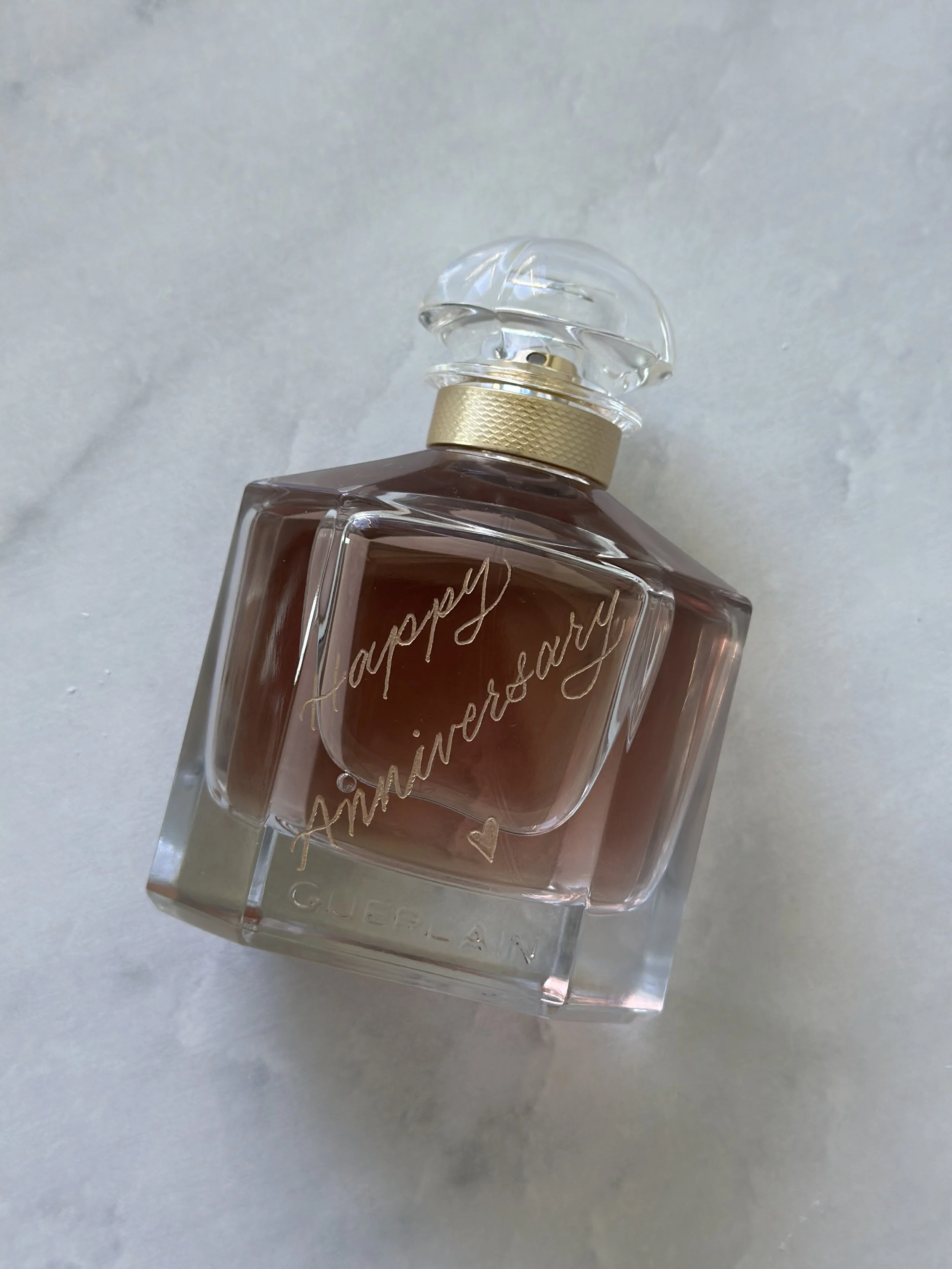 Engraved Gurlain perfume bottle.