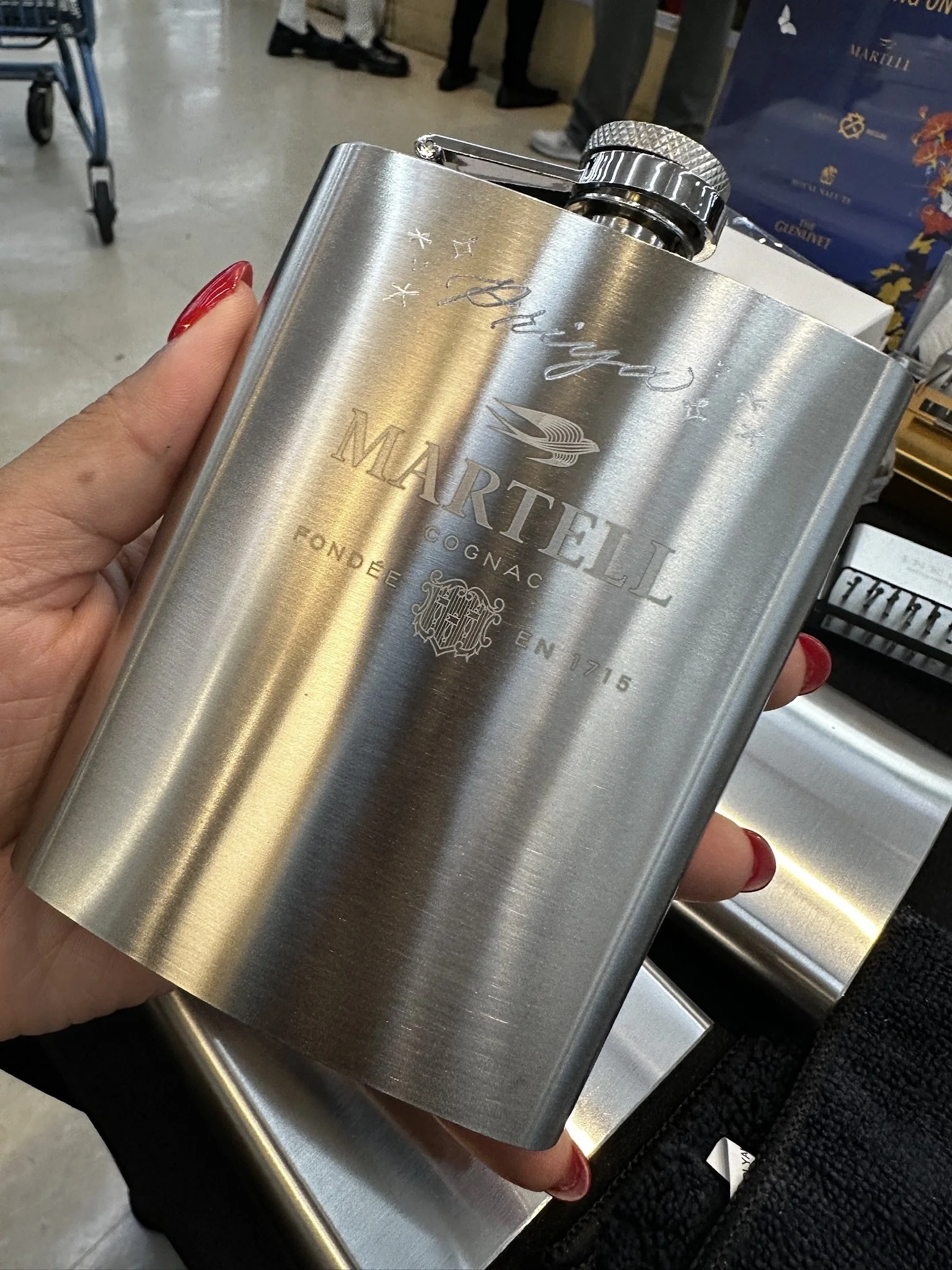 Engraved Martell silver drinking flask.