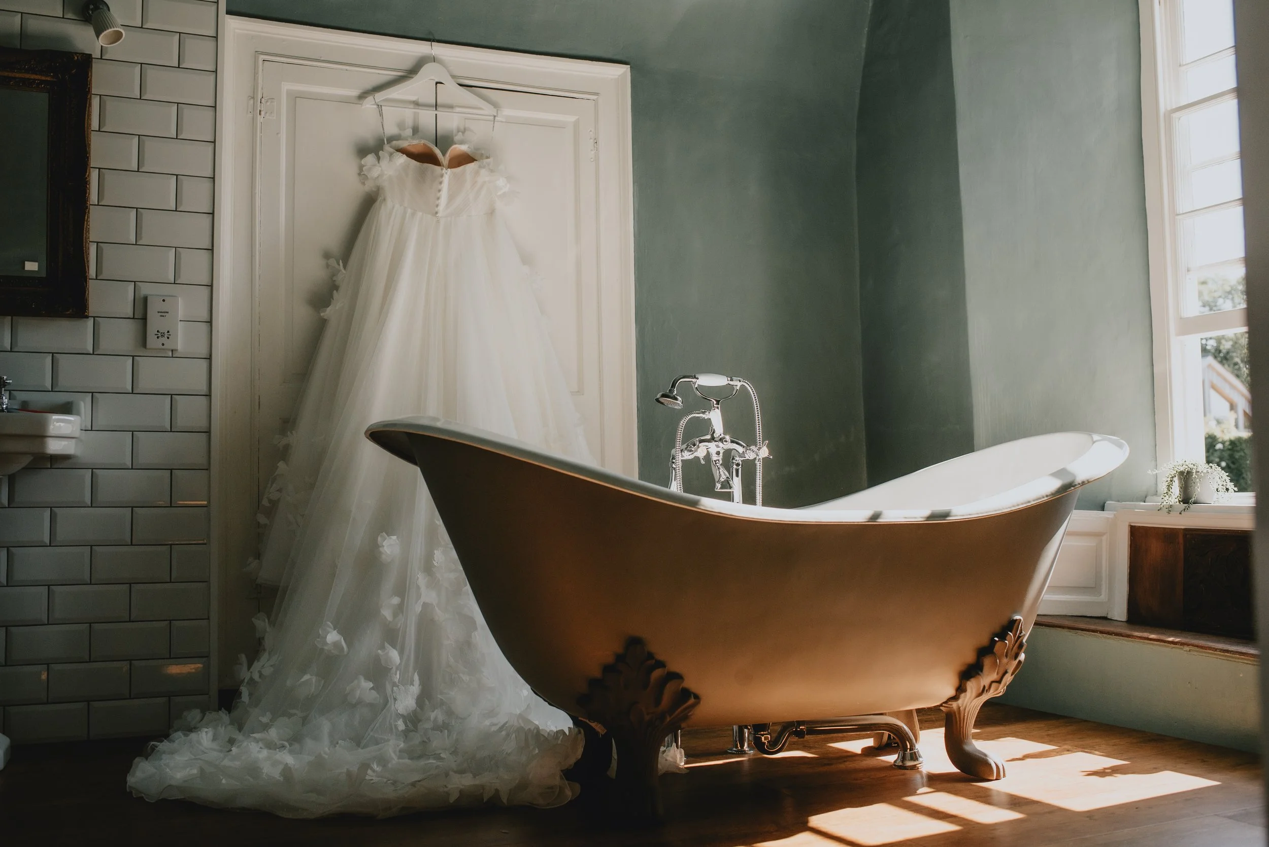Wedding dress detail shot with bathtub