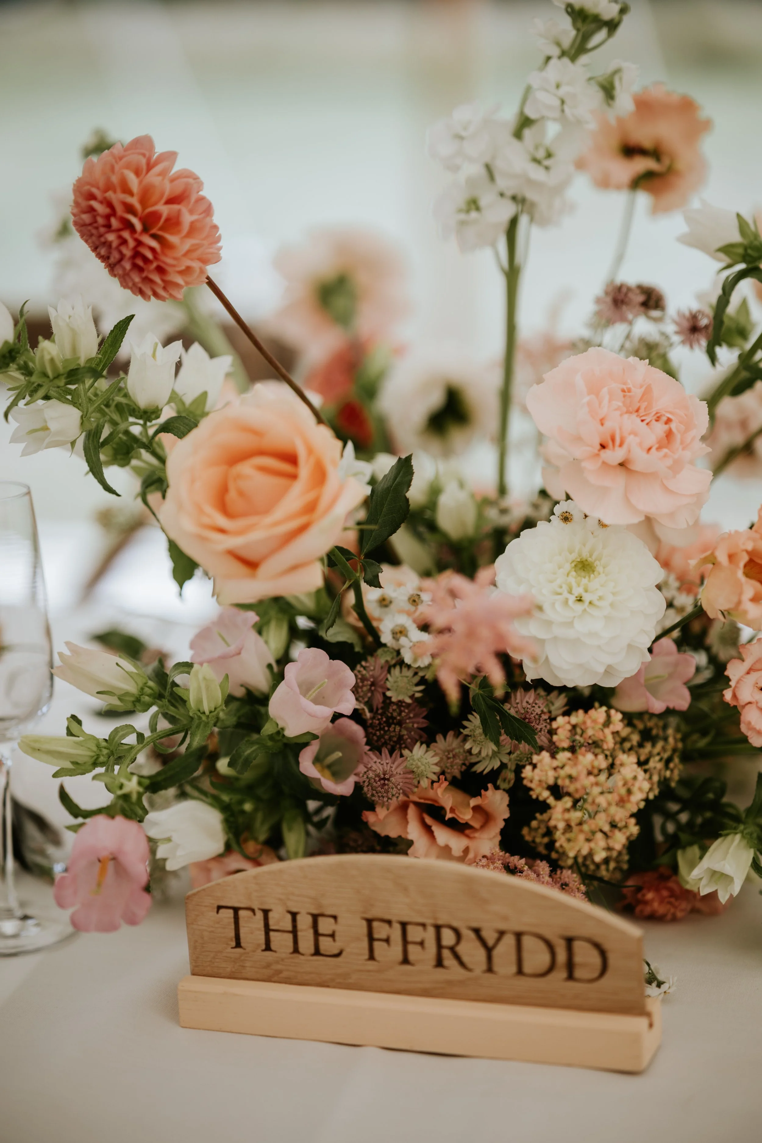 Blush floral table centrepiece for Welsh wedding
