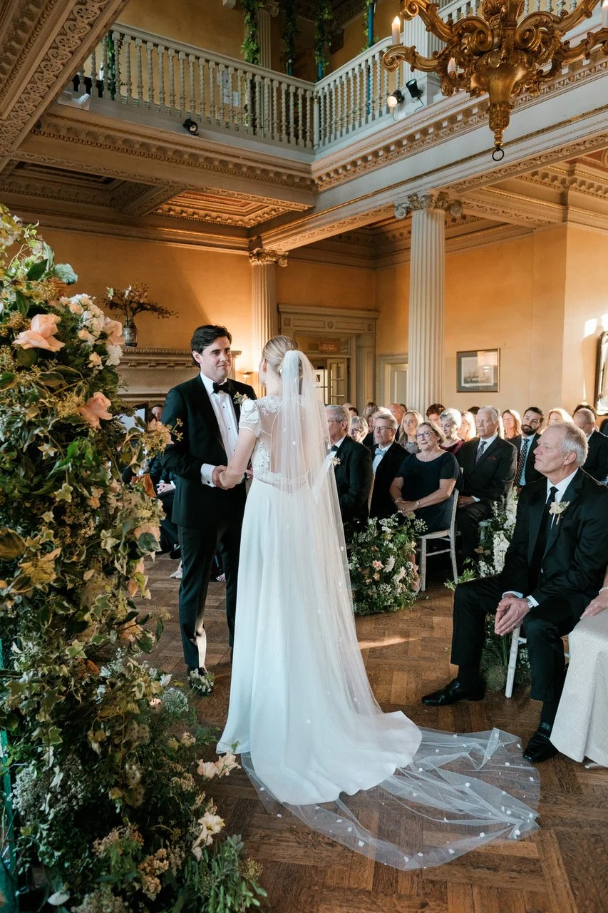 Couple exchange vows in traditional London wedding venue