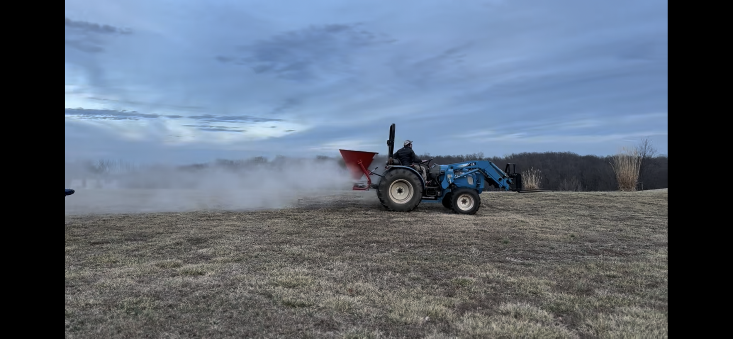 Kyle Marret spreading limestone on his home vineyard.
