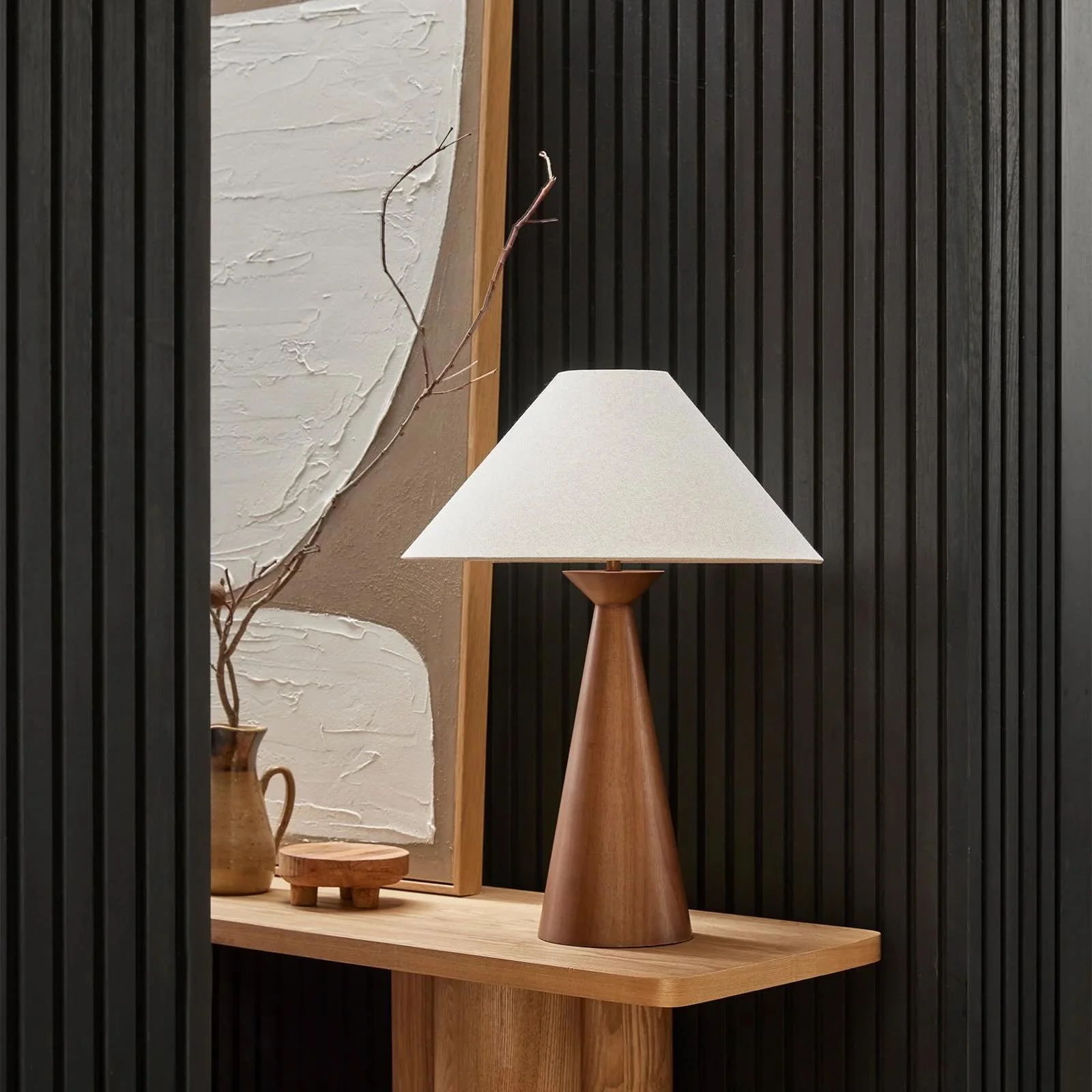 Natural timber, soft linen and a simple sculptural form. Warm, understated and timeless.

Emba Table Lamp.