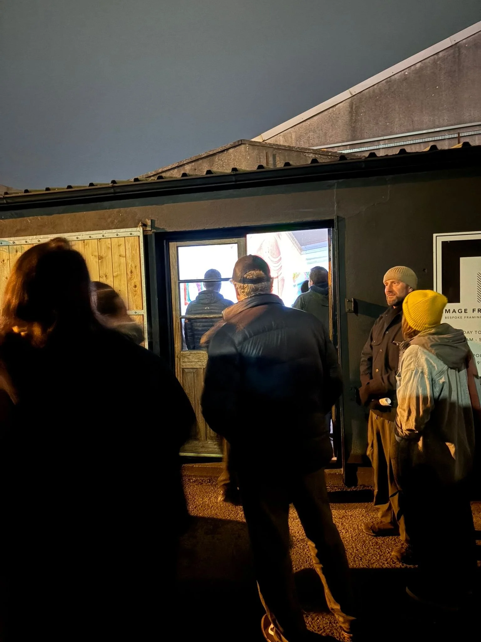Visitors outside Scenius Gallery 2 at Image Framers for the Wake II exhibition