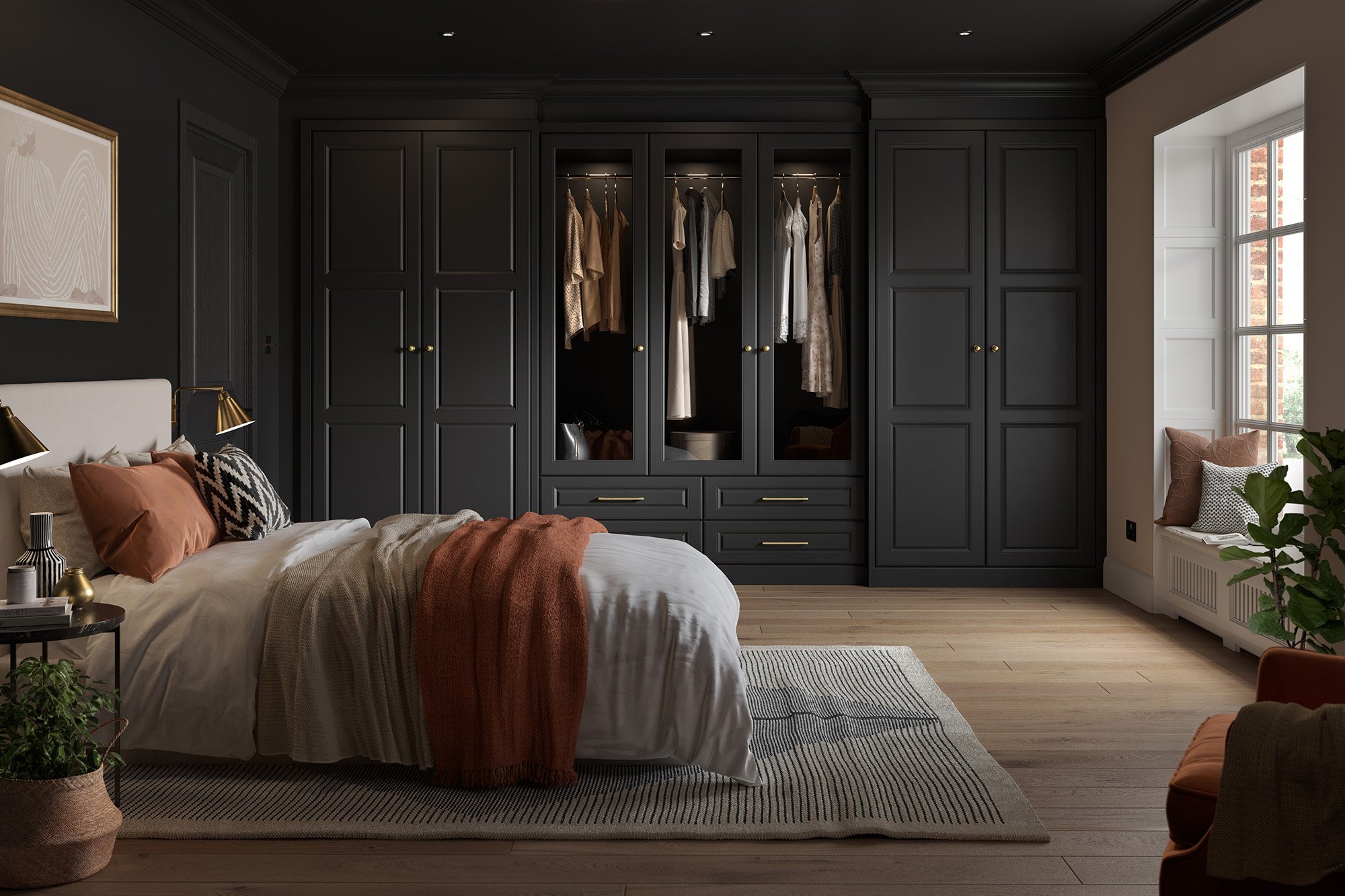 Contemporary bedroom with dark wardrobes, large bed, white and orange bedding, decorative pillows, a striped rug, and a large window seat.