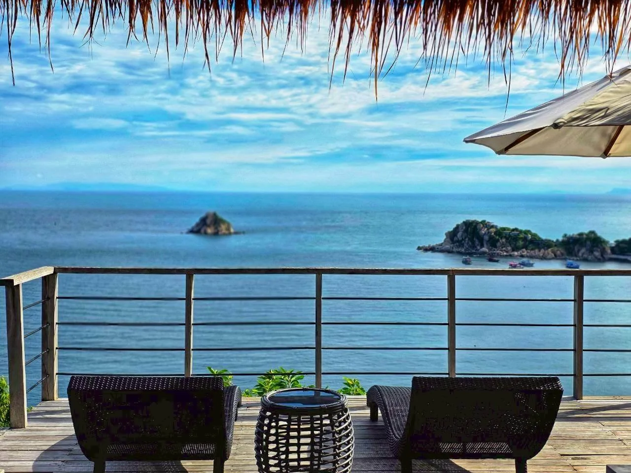 Private terrace with island view under thatched roof, Villa Pavana Koh Tao Thailand