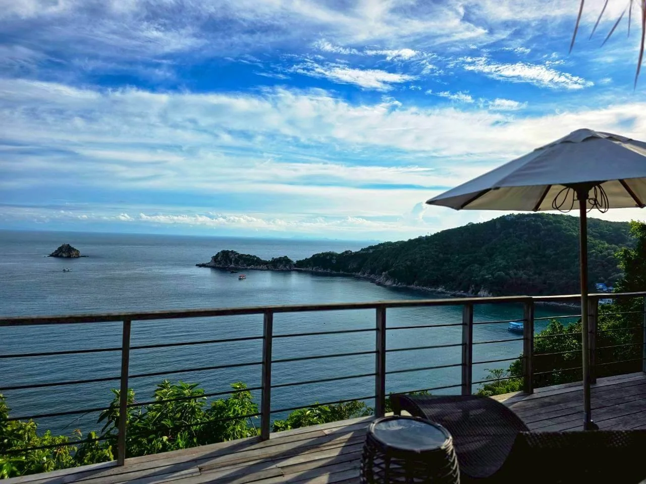 Private terrace with island view under thatched roof, Villa Pavana Koh Tao Thailand
